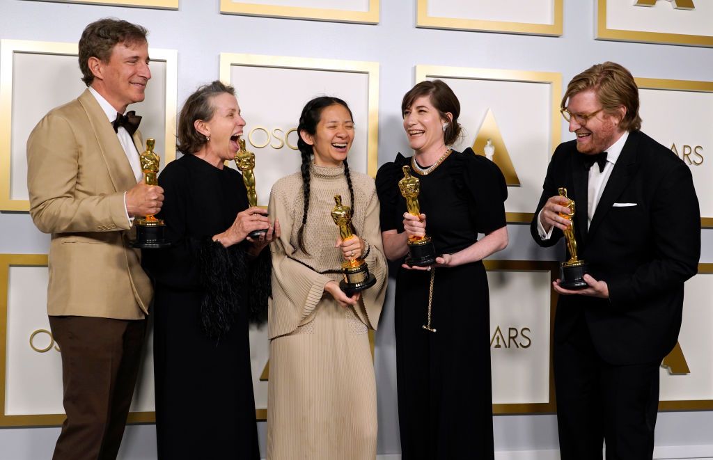 LOS ANGELES, CALIFORNIA - APRIL 25: (L-R) Peter Spears, Frances McDormand, Chloe Zhao, Mollye Asher, and Dan Janvey, winners of Best Picture for "Nomadland," pose in the press room at the Oscars on Sunday, April 25, 2021, at Union Station in Los Angeles. (Photo by Chris Pizzello-Pool/Getty Images)