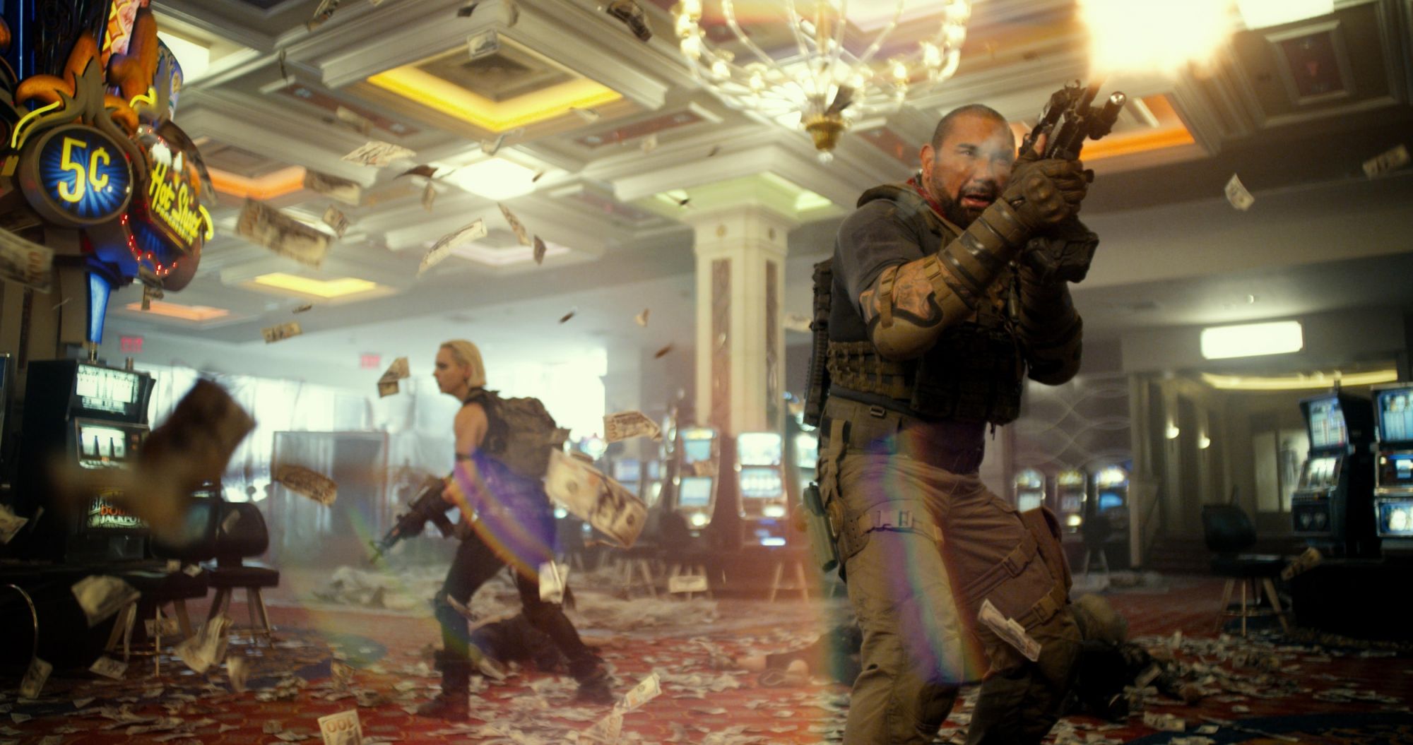 ARMY OF THE DEAD - (L-R) NORA ARNEZEDER as LILLY and DAVE BAUTISTA as SCOTT WARD. Cr: NETFLIX © 2021