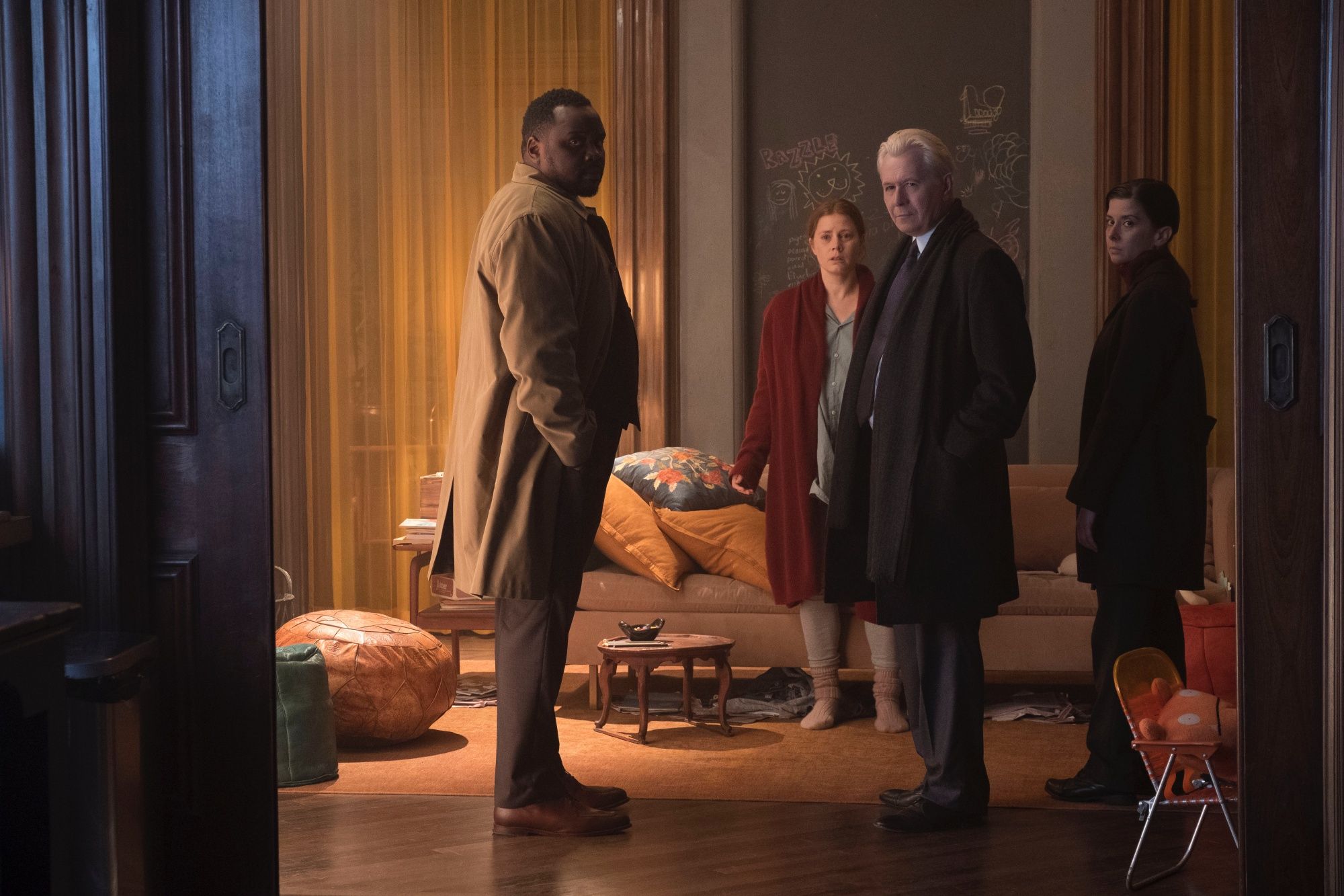 Woman in the Window (2021), L to R: Brian Tyree Henry as Detective Little, Amy Adams as Anna Fox, Gary Oldman as Alistair Russell, and Jeanine Serralles as Detective Norelli