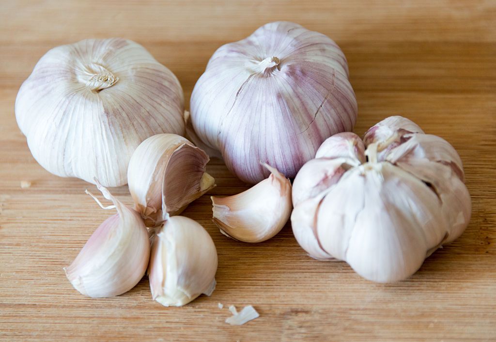 TORONTO, ONTARIO, CANADA - 2015/03/30: Garlic: realistic approach to food ingredients.Chilean garlic is popular in Latin American cuisine, the large cloves give excellent taste to meals. Garlic in wooden surface,natural light, shallow dof. (Photo by Roberto Machado Noa/LightRocket via Getty Images)