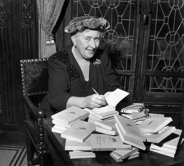 British mystery author Agatha Christie (1890-1976) autographing French editions of her books, circa 1950. (Photo by Hulton Archive/Getty Images)
