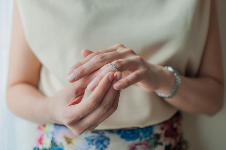 A close-up view of a young woman wearing her wedding ring