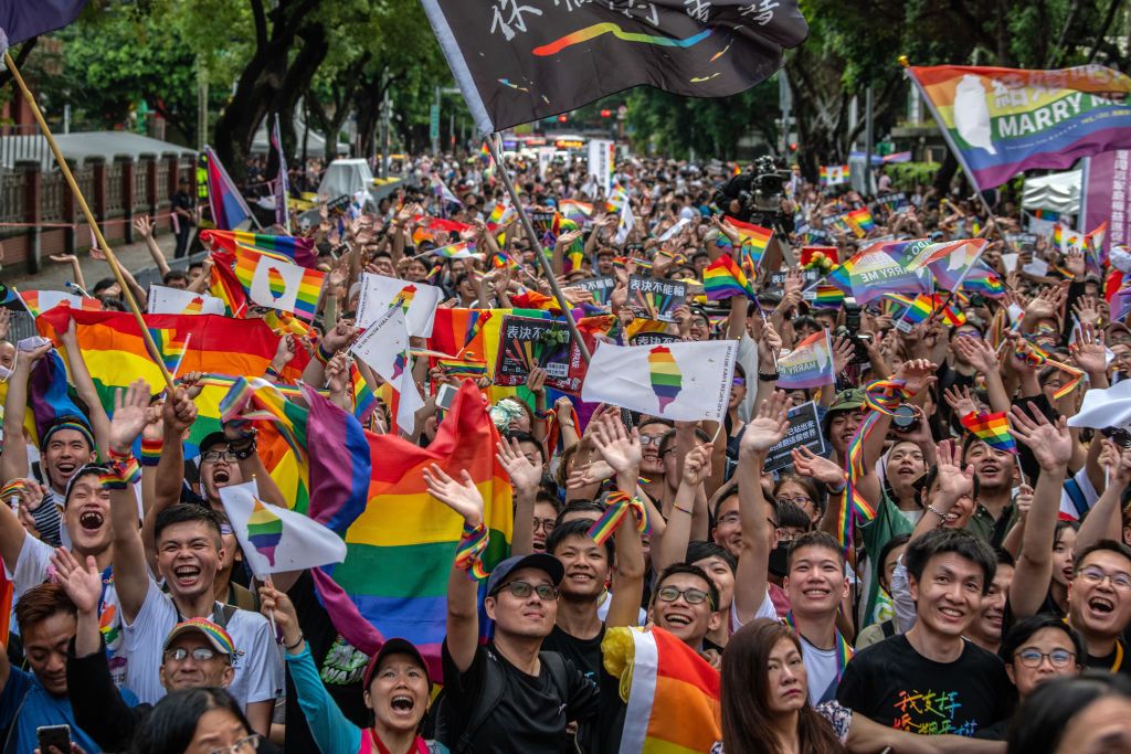 TAIPEI, TAIWAN - MAY 17: People celebrate after Taiwan's parliament voted to legalise same-sex marriage on May 17, 2019 in Taipei, Taiwan. Taiwan became the first country in Asia to legalise same-sex marriage after lawmakers voted on Friday to allow same-sex couples full legal marriage rights, including areas in taxes, insurance and child custody. Thousands of gay rights supporters gathered outside the parliament building in the nation's capital as the result was announced. The bill will go into effect on M