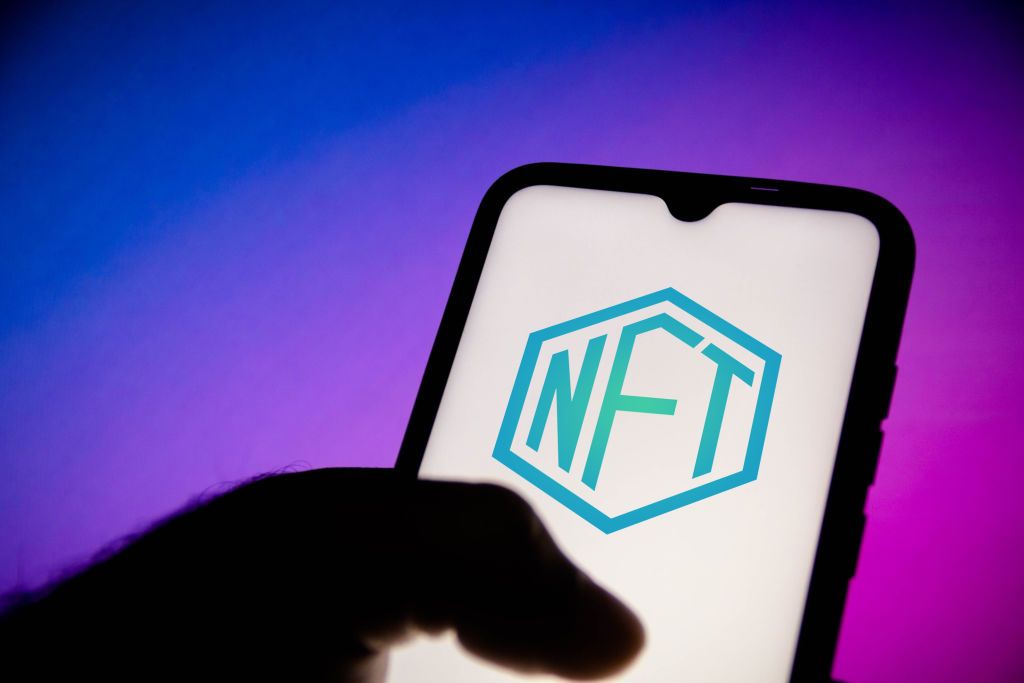 BRAZIL - 2021/06/16: In this photo illustration, a NFT (Non-fungible token) logo seen displayed on a smartphone. (Photo Illustration by Rafael Henrique/SOPA Images/LightRocket via Getty Images)