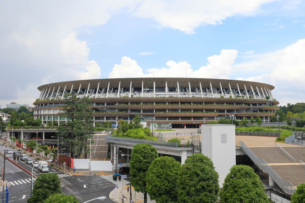 TOKYO, JAPAN - 2021/06/17: New National Stadium with Tokyo 2020 Olympic Games branding.Construction of facilities for the Olympic games is still going on with only a few weeks to the opening of the controversial Summer Olympic Games. (Photo by Stanislav Kogiku/SOPA Images/LightRocket via Getty Images)