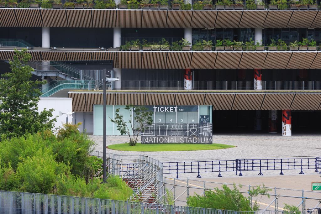 TOKYO, JAPAN - 2021/06/17: New National Stadium with Tokyo 2020 Olympic Games branding.Construction of facilities for the Olympic games is still going on with only a few weeks to the opening of the controversial Summer Olympic Games. (Photo by Stanislav Kogiku/SOPA Images/LightRocket via Getty Images)