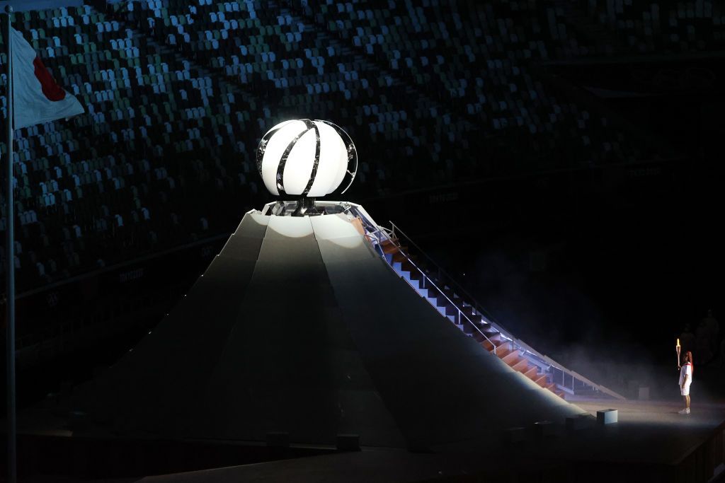 TOKYO, JAPAN JULY 23, 2021: Tennis player Naomi Osaka lights the Olympic Cauldron atop a mini Mount Fuji at the opening ceremony of the Tokyo 2020 Summer Olympic Games at the National Stadium. Tokyo was to host the 2020 Summer Olympics from 24 July to 9 August 2020, however because of the COVID-19 pandemic the games have been postponed for a year and are due to take place from 23 July to 8 August 2021. Stanislav Krasilnikov/TASS (Photo by Stanislav Krasilnikov\TASS via Getty Images)