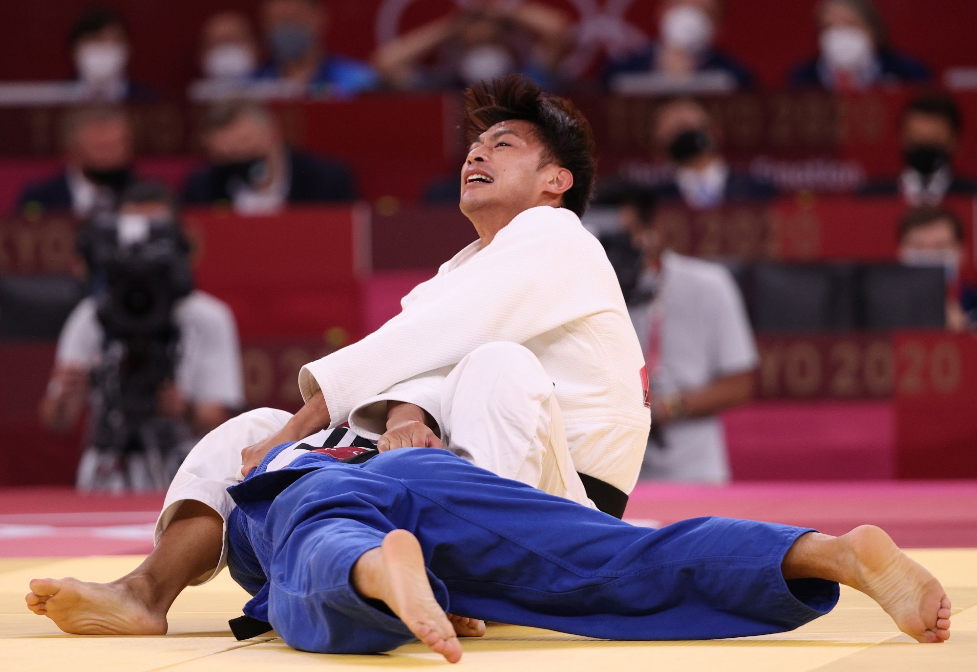 TOKYO, JAPAN - JULY 24: Naohisa Takato of Team Japan and Wei Yung Yang of Chinese Taipei compete during the Menâs Judo 60kg Final on day one of the Tokyo 2020 Olympic Games at Nippon Budokan on July 24, 2021 in Tokyo, Japan. (Photo by Harry How/Getty Images)