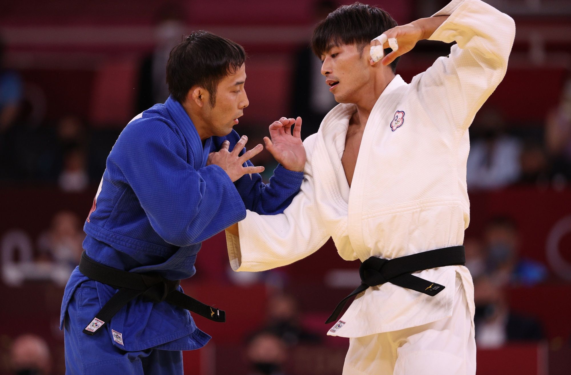 TOKYO, JAPAN - JULY 24: Naohisa Takato of Team Japan and Wei Yung Yang of Chinese Taipei compete during the Menâs Judo 60kg Final on day one of the Tokyo 2020 Olympic Games at Nippon Budokan on July 24, 2021 in Tokyo, Japan. (Photo by Harry How/Getty Images)