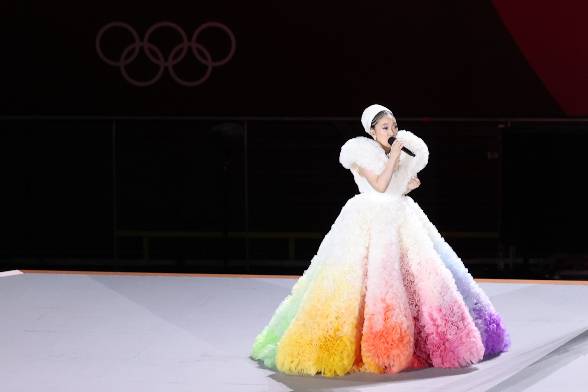 TOKYO, JAPAN - JULY 23: Singer Misia performs a Japanese national anthem as a Japanese national flag being raised during the Opening Ceremony of the Tokyo 2020 Olympic Games at Olympic Stadium on July 23, 2021 in Tokyo, Japan. (Photo by Wu Zhizhao/VCG via Getty Images)