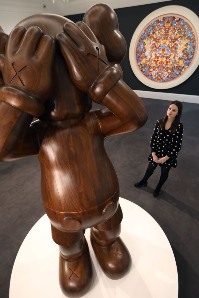 LONDON, ENGLAND - FEBRUARY 07: Works by Kaws and Damien Hirst are displayed at Sotheby's on February 07, 2020 in London, England. (Photo by Tristan Fewings/Getty Images for Sotheby's)
