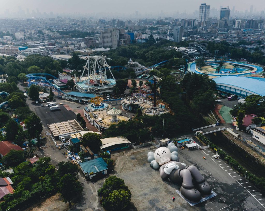 TOKYO, JAPAN - JUNE 25: In this handout image provided by AllRightsReserved, the inflatable test of KAWS:HOLIDAY JAPAN is seen at Toshimaen on June 25, 2019 in Tokyo, Japan. After visiting Seoul, Taipei and Hong Kong, the 40-meter-long COMPANION in collaboration with AllRightsReserved unveils with a new camping experience starting from 18 July to 24 July, 2019 at Fumotoppara camp site which overlooks Mount Fuji in Japan.  (Photo by AllRightsReserved via Getty Images)
