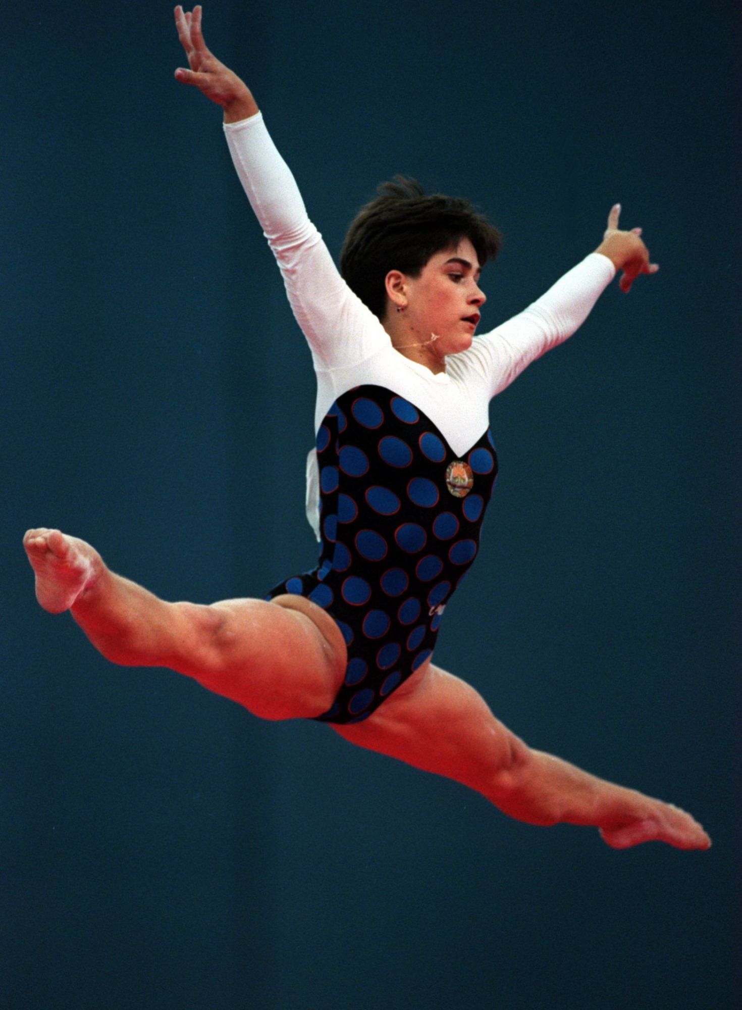 1 AUG 1994: OKSANA CHUSOVITINA OF UZBEKISTAN STRETCHES HER ARMS UPWARDS AND HER LEGS IN PERFECT SPLITS AS SHE IS IN THE AIR DURING HER FLOOR EXERCISE DURING THE WOMENS INDIVIDUAL APPARATUS COMPETITION AT THE GOODWILL GAMES IN ST PETERSBURG. MandatoryCredit: Chris Cole/ALLSPORT