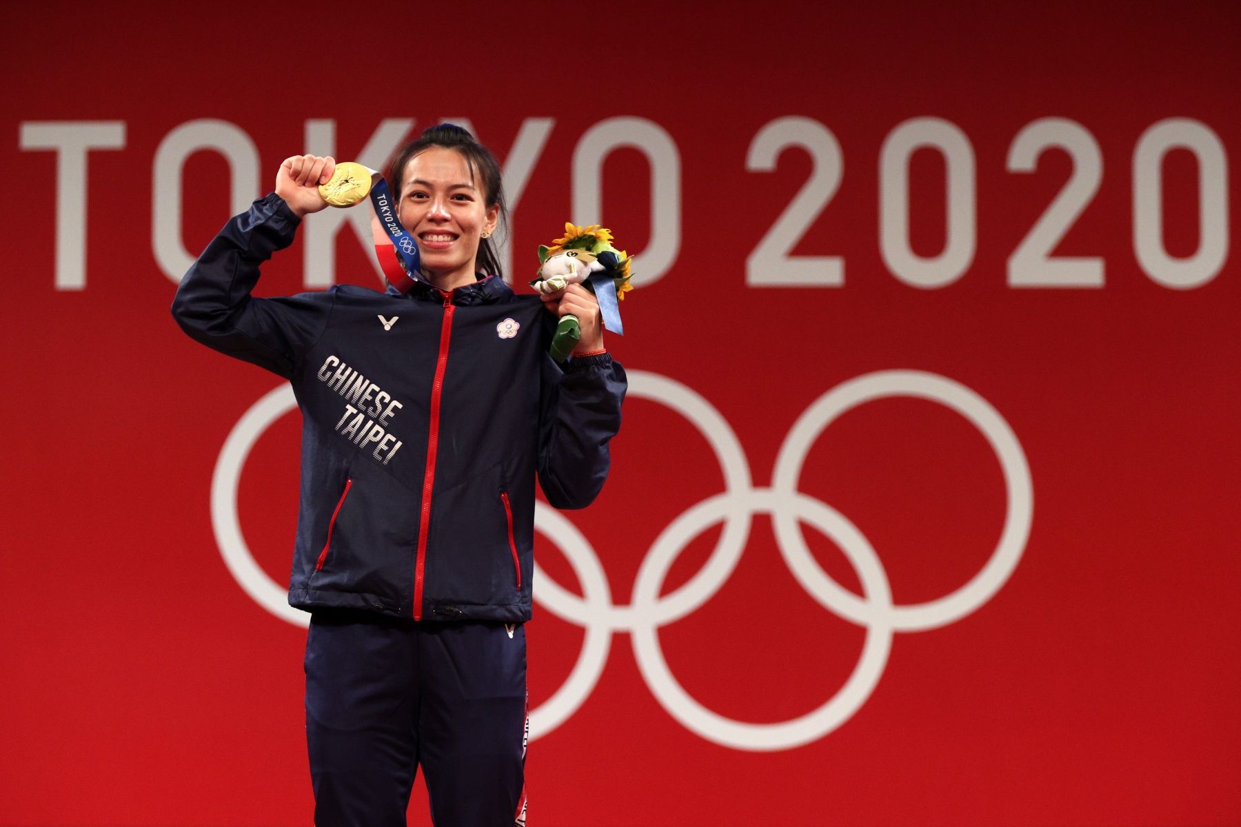 TOKYO, JAPAN - JULY 27: Gold medalist Hsing-Chun Kuo of Team Chinese Taipei poses with the gold medal during the medal ceremony for the Weightlifting - Women's 59kg Group A on day four of the Tokyo 2020 Olympic Games at Tokyo International Forum on July 27, 2021 in Tokyo, Japan. (Photo by Chris Graythen/Getty Images)