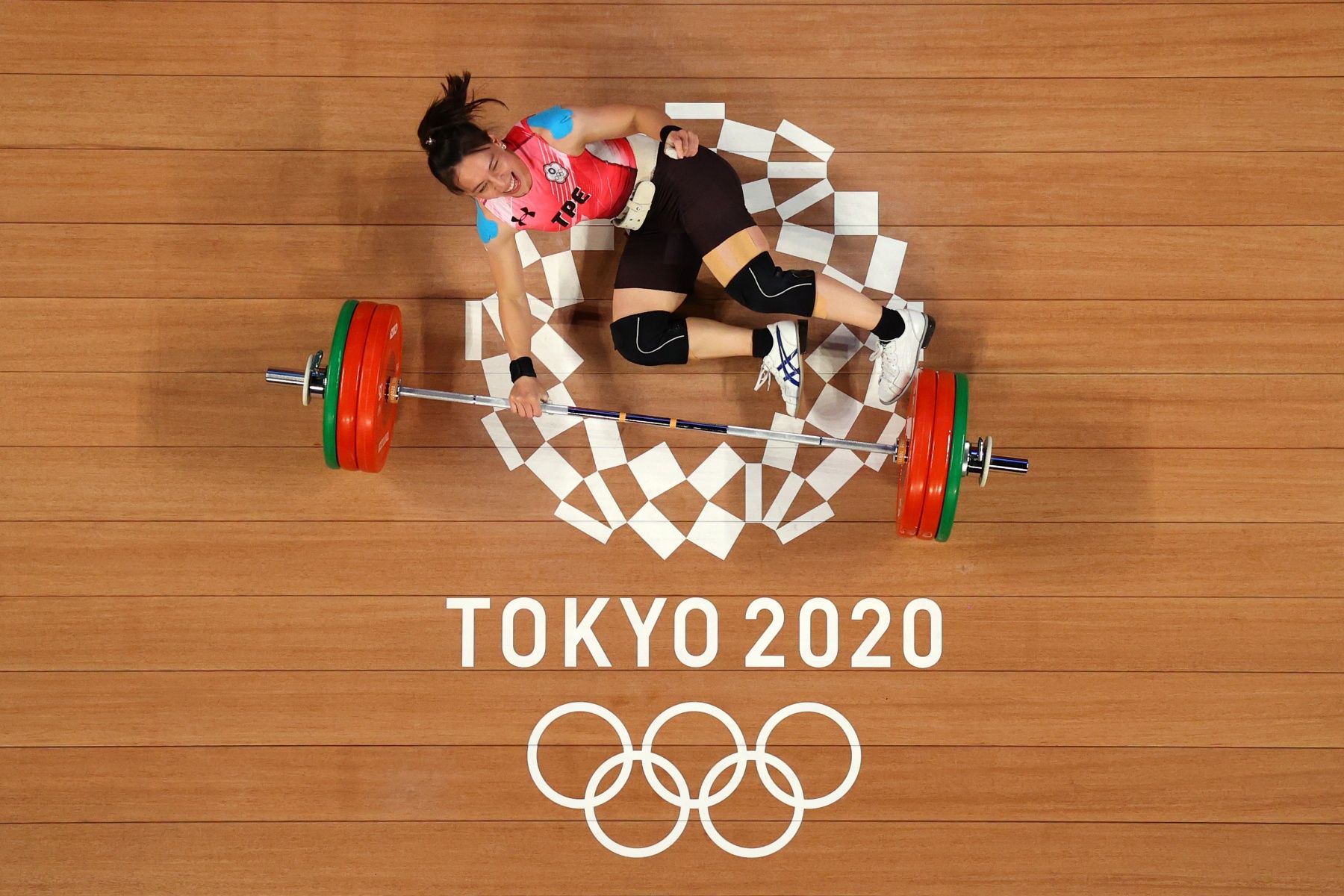 TOKYO, JAPAN - JULY 27: Hsing-Chun Kuo of Team Chinese Taipei competes during the Weightlifting - Women's 59kg Group A on day four of the Tokyo 2020 Olympic Games at Tokyo International Forum on July 27, 2021 in Tokyo, Japan. (Photo by Chris Graythen/Getty Images)