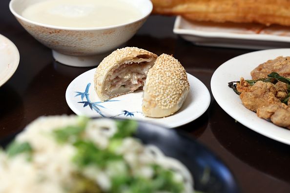 LOS ANGELES, CA - JUNE 10: A Baked Turnip Cake is photographed with an assortment of specialty dishes from YungHo Cafe, a famous Taiwanese breakfast and brunch cafe, on Valley Boulevard in San Gabriel Valley on Thursday, June 10, 2021 in Los Angeles, CA. Their customers dropped off for a bit during the pandemic but now they are back at 80 percent serving clients inside and to go. (Dania Maxwell / Los Angeles Times via Getty Images)