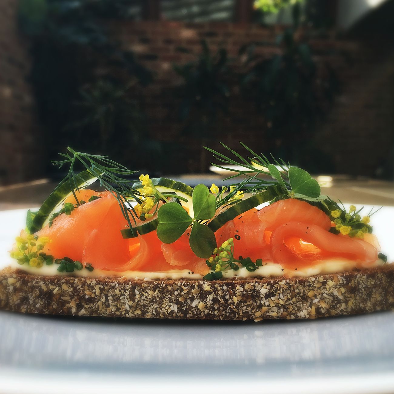 Lapsang Souchong tea-smoked salmon with sour cream butter, caviar and soda bread, a signature dish of Blumenthal's one Michelin-starred gastropub The Hind’s Head