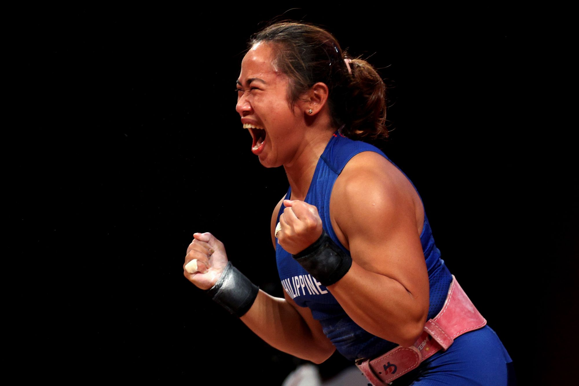 TOKYO, JAPAN - JULY 26: Hidilyn Diaz of Team Philippines competes during the Weightlifting - Women's 55kg Group A on day three of the Tokyo 2020 Olympic Games at Tokyo International Forum on July 26, 2021 in Tokyo, Japan. (Photo by Chris Graythen/Getty Images)
