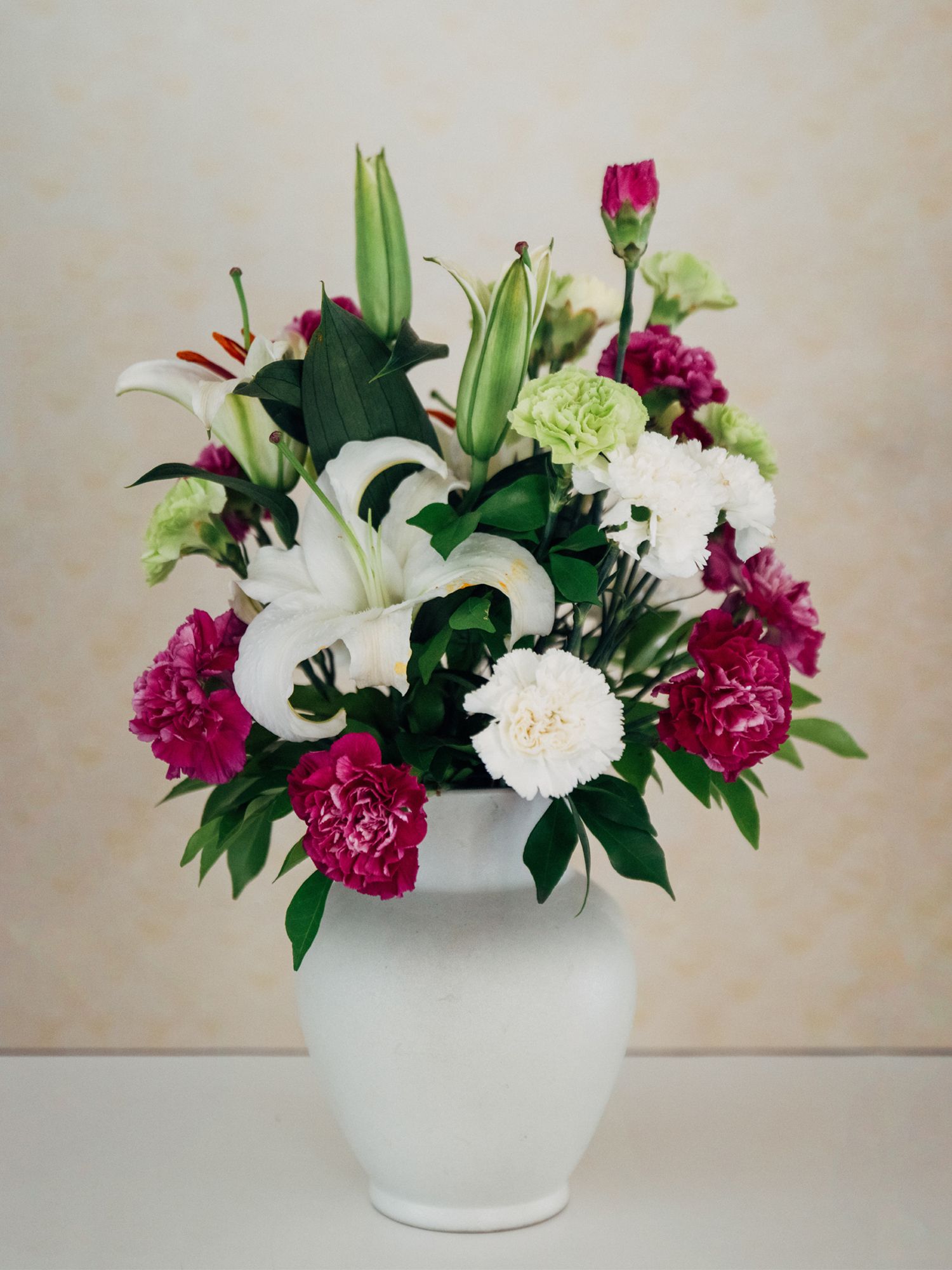 An red and white floral arrangement definitely amps up the National Day spirit in your abode
