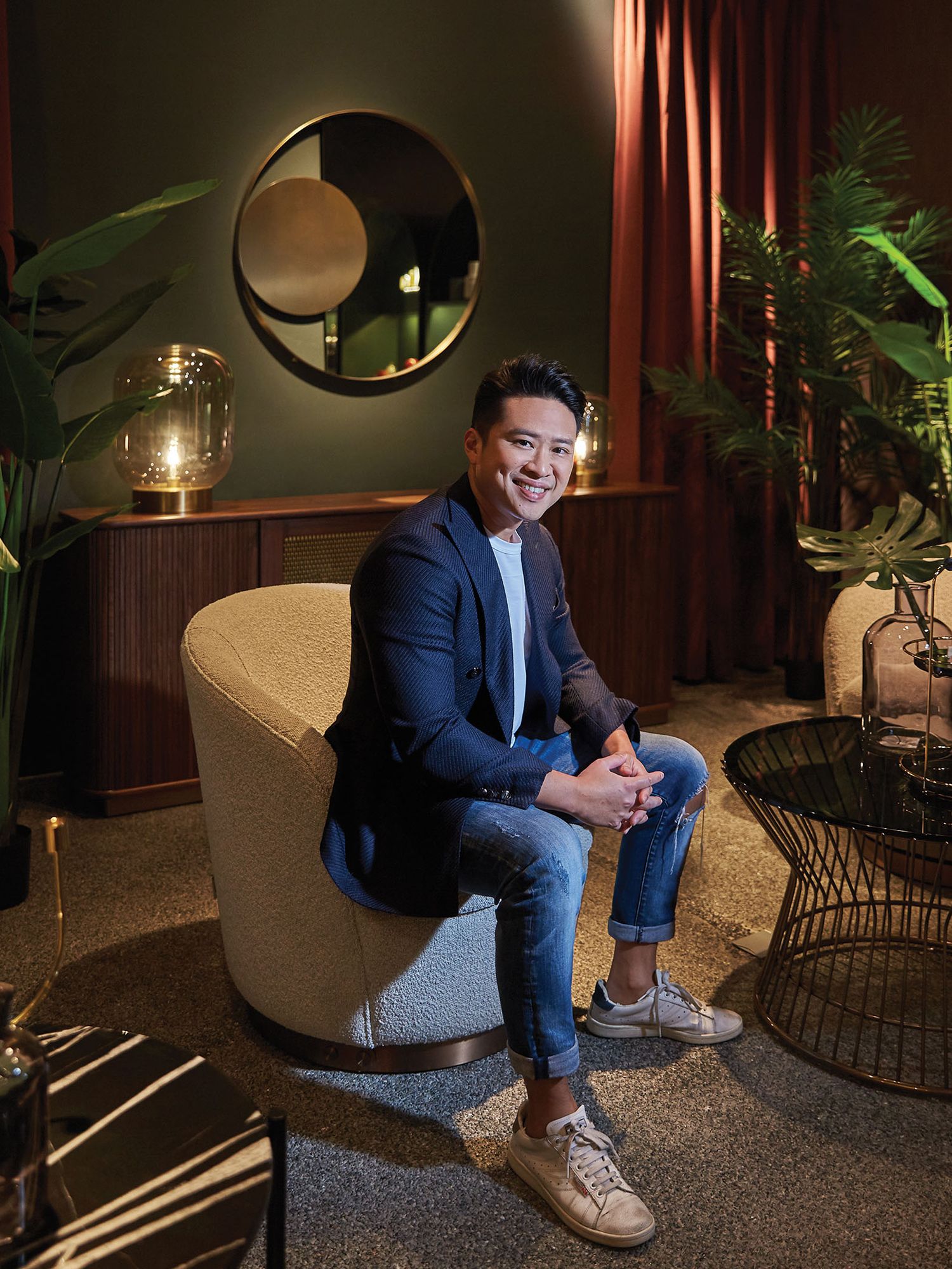 Commune chief design officer Julian Koh sits at the Alt.o section of the brand’s Millenia Walk showroom