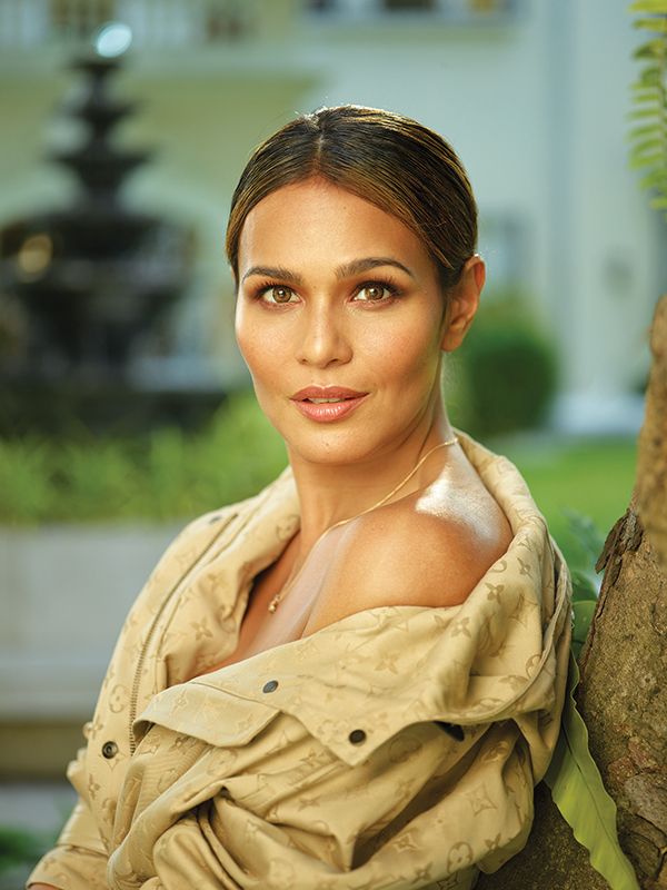 Iza Calzado and Ben Wintle for Tatler Philippines | Photo by Mark Nicdao. Calzado wears a Monogram Jacquard Gabardine relaxed hooded parka, LV Volt One small pendant in pink gold and diamond, and Tambour Slim Infini 35 watch all by Louis Vuitton