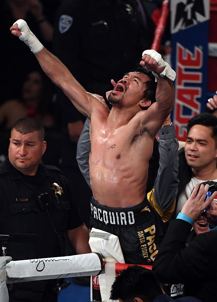 LAS VEGAS, NV - Manny Pacquiao celebrates his unanimous-decision victory over Jessie Vargas to win the WBO welterweight championship title at the Thomas & Mack Centre on 5 November 2016. (PHOTO: Ethan Miller/Getty Images)