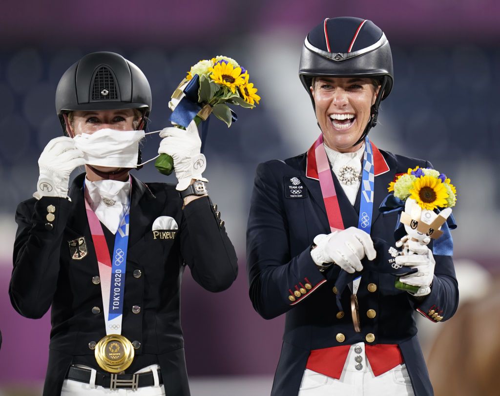 Great Britain's Charlotte Dujardin (right) celebrates winning bronze in the Grand Prix Freestyle - Individual Final, on Gio, to become Great Britains most decorated female Olympian with six medals, alongside gold medalist Germany's Jessica von Bredow-Werndl, on the fifth day of the Tokyo 2020 Olympic Games in Japan. Picture date: Wednesday July 28, 2021. (Photo by Danny Lawson/PA Images via Getty Images)
