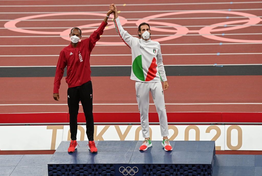 Tokyo , Japan - 2 August 2021; Joint gold medalists Mutaz Essa Barshim of Qatar, left, and Gianmarco Tamberi of Italy during the Men's High Jump Victory Ceremony at the Olympic Stadium on day ten of the 2020 Tokyo Summer Olympic Games in Tokyo, Japan. (Photo By Ramsey Cardy/Sportsfile via Getty Images)