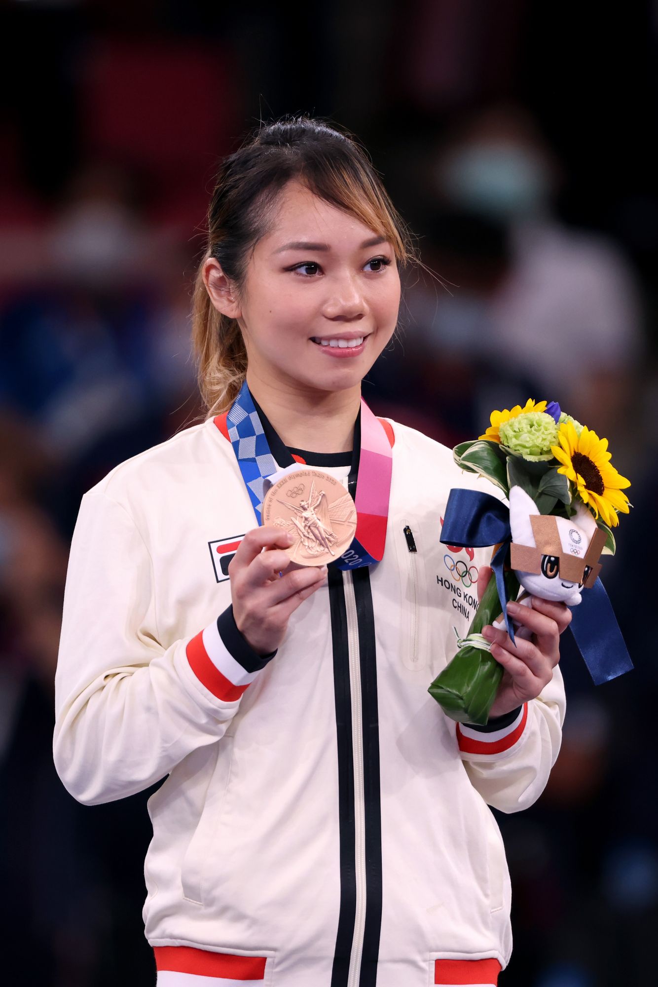 TOKYO, JAPAN - AUGUST 05: Bronze medalist Grace Lau Mo-sheung of Team Hong Kong poses with the bronze medal for the Womenâs Karate Kata on day thirteen of the Tokyo 2020 Olympic Games at Nippon Budokan on August 05, 2021 in Tokyo, Japan. (Photo by Harry How/Getty Images)