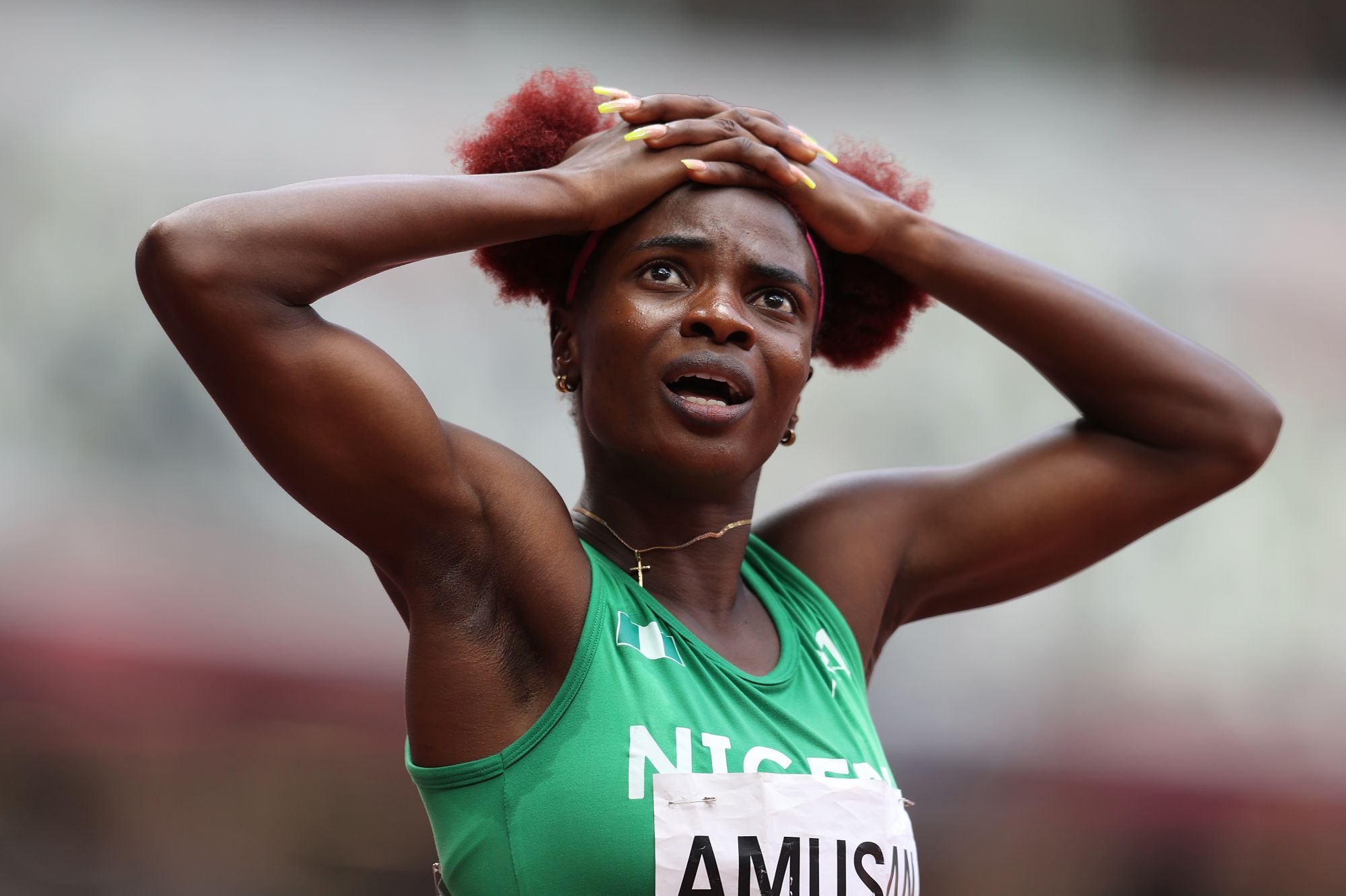 TOKYO, JAPAN - AUGUST 02: Tobi Amusan of Team Nigeria reacts during the Women's 100m Hurdles Final on day ten of the Tokyo 2020 Olympic Games at Olympic Stadium on August 02, 2021 in Tokyo, Japan. (Photo by Michael Steele/Getty Images)