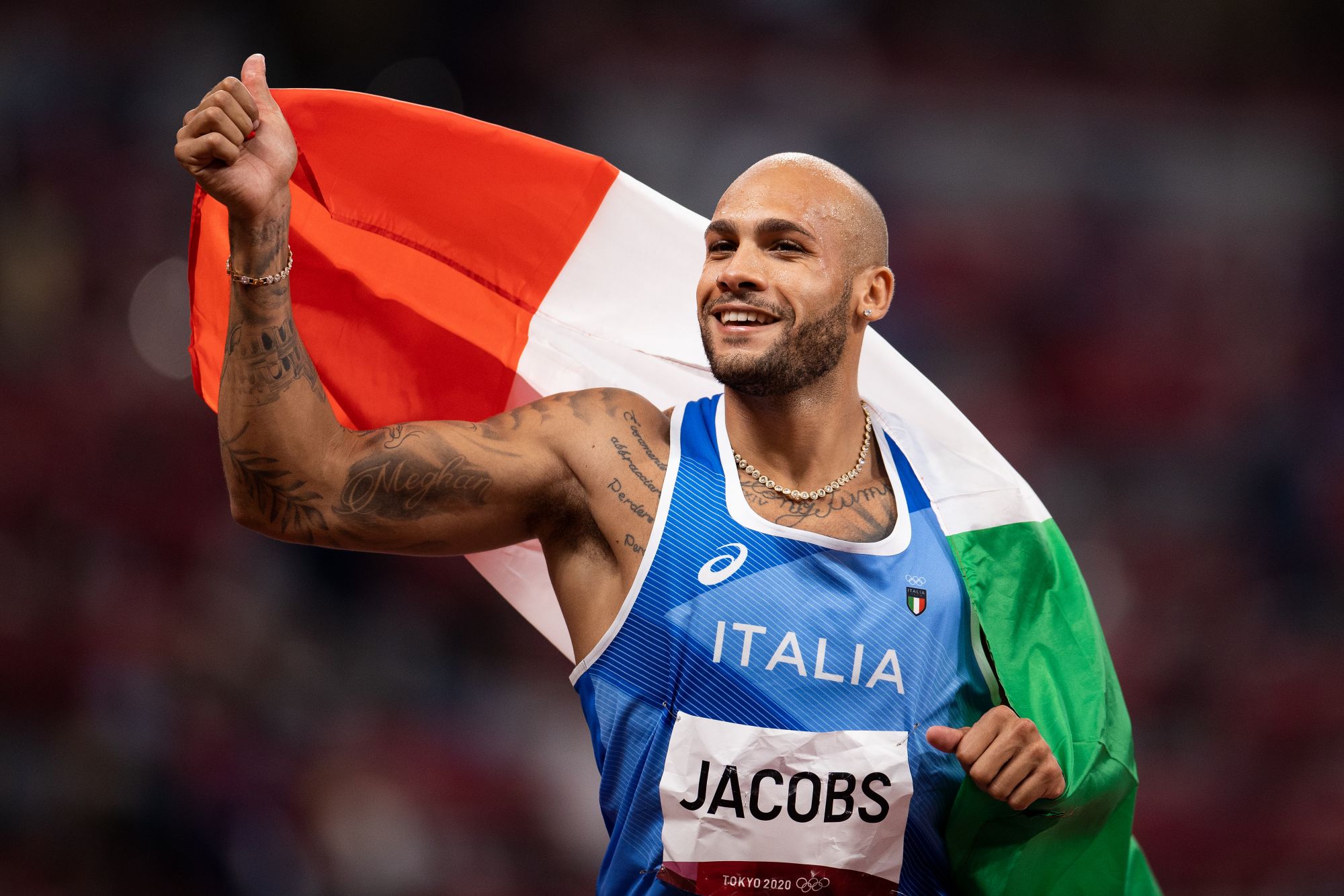 TOKYO, JAPAN - AUGUST 01: Lamont Marcell Jacobs of Team Italy celebrates after winning the Men's 100m Final on day nine of the Tokyo 2020 Olympic Games at Olympic Stadium on August 01, 2021 in Tokyo, Japan. (Photo by David Ramos/Getty Images)