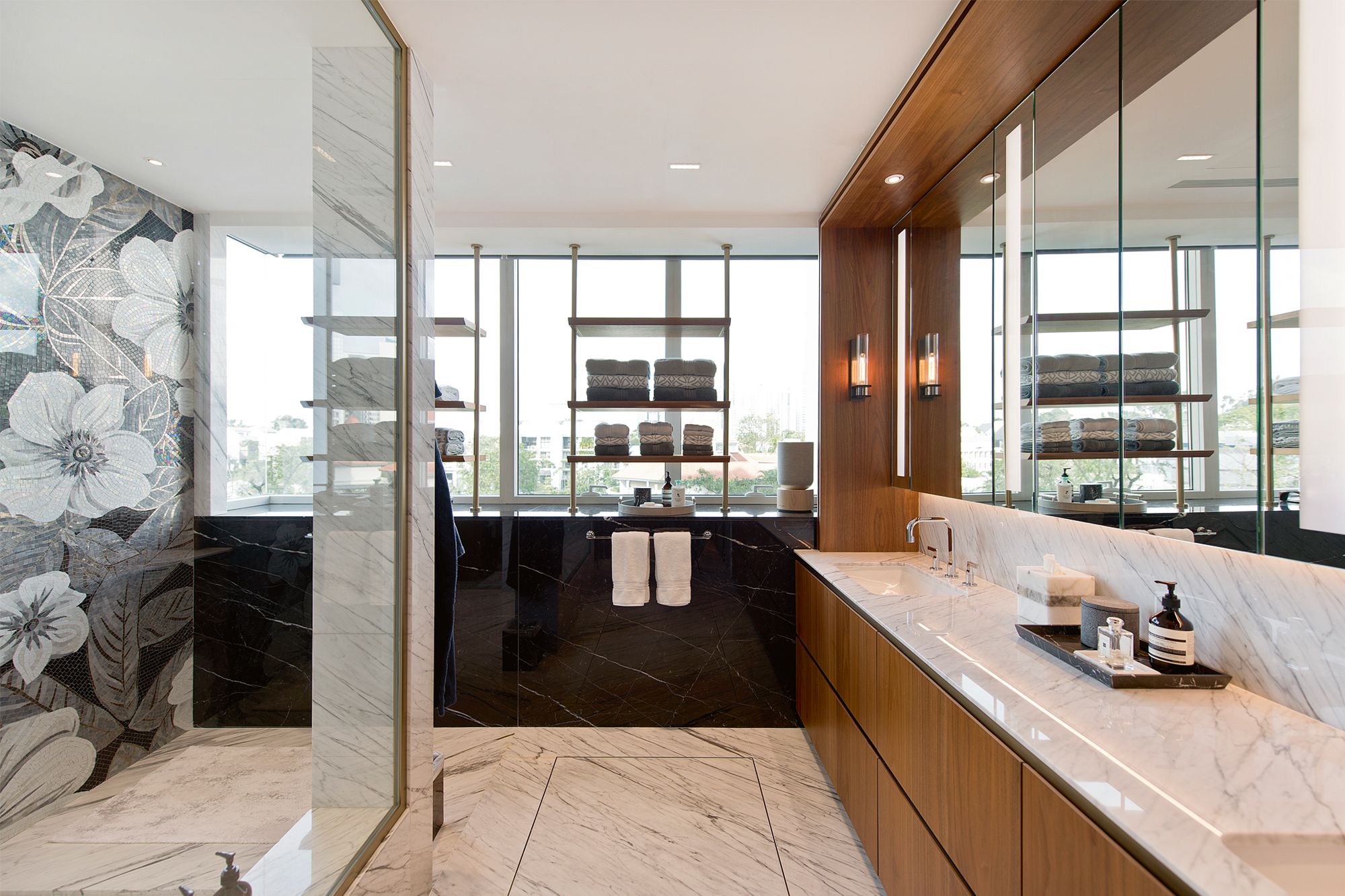 This floral mosaic feature wall is the centrepiece of the light-filled master bathroom