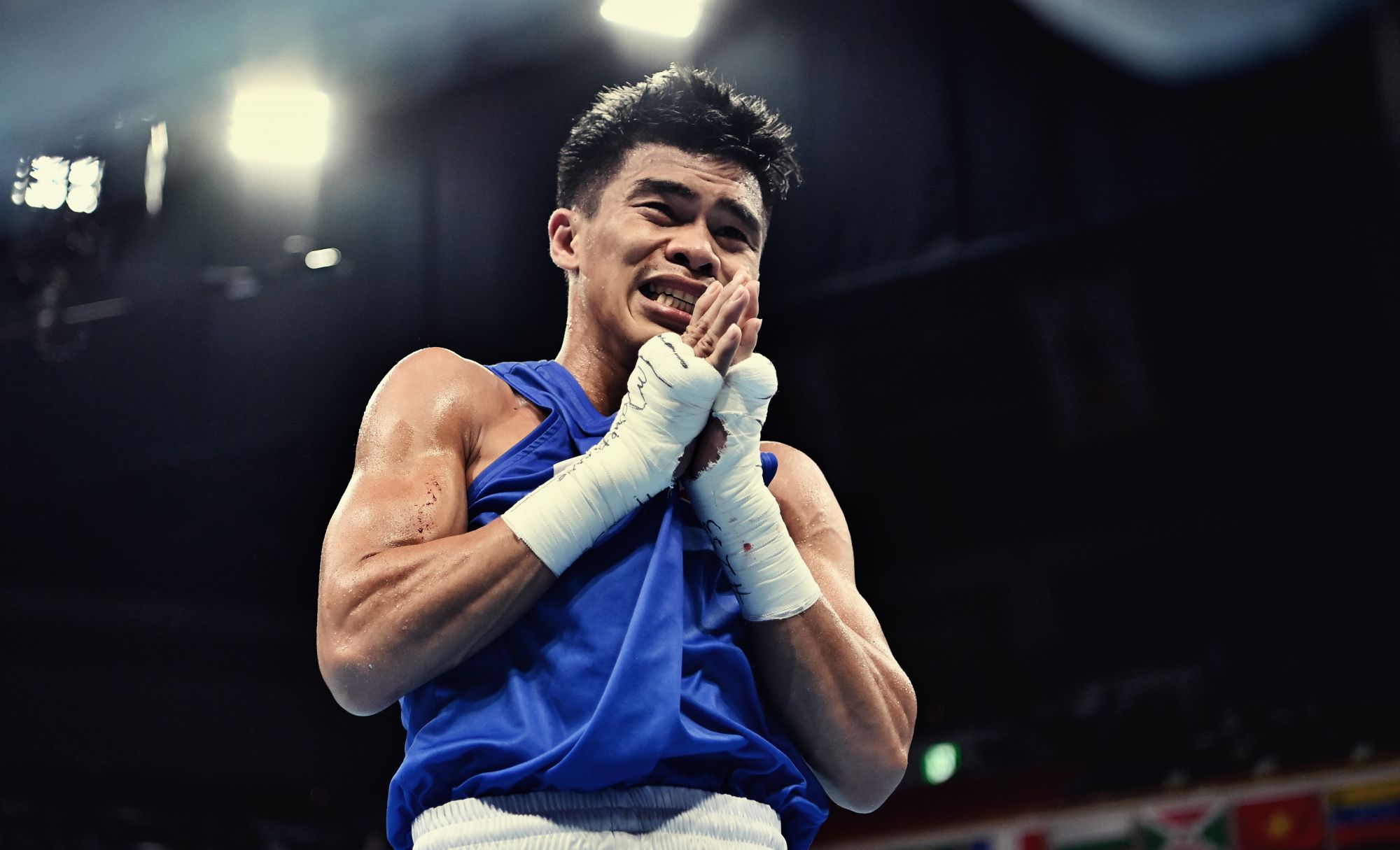 TOKYO, JAPAN - AUGUST 03: Carlo Paalam of Team Philippines celebrates vicrory over Shakhobidin Zoirov of Team Uzbekistan during the Men's Fly (48-52kg) quarter final on day eleven of the Tokyo 2020 Olympic Games at Kokugikan Arena on August 03, 2021 in Tokyo, Japan. (Photo by Luis Robayo - Pool/Getty Images)