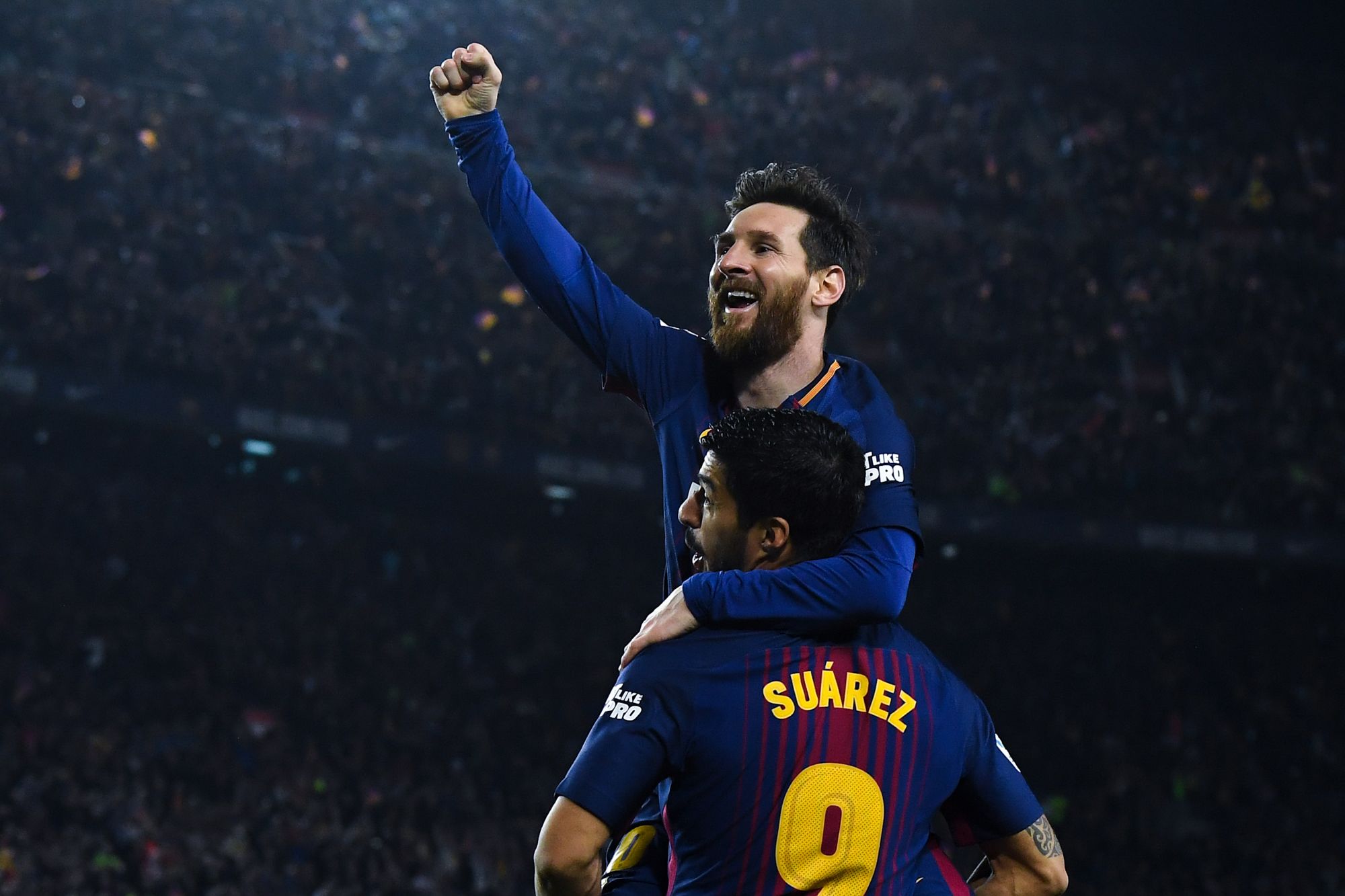 BARCELONA, SPAIN - MAY 06: Lionel Messi of FC Barcelona celebrates with his team mate Luis Suarez after scoring his team's second goal during the La Liga match between Barcelona and Real Madrid at Camp Nou on May 6, 2018 in Barcelona, Spain. (Photo by David Ramos/Getty Images)