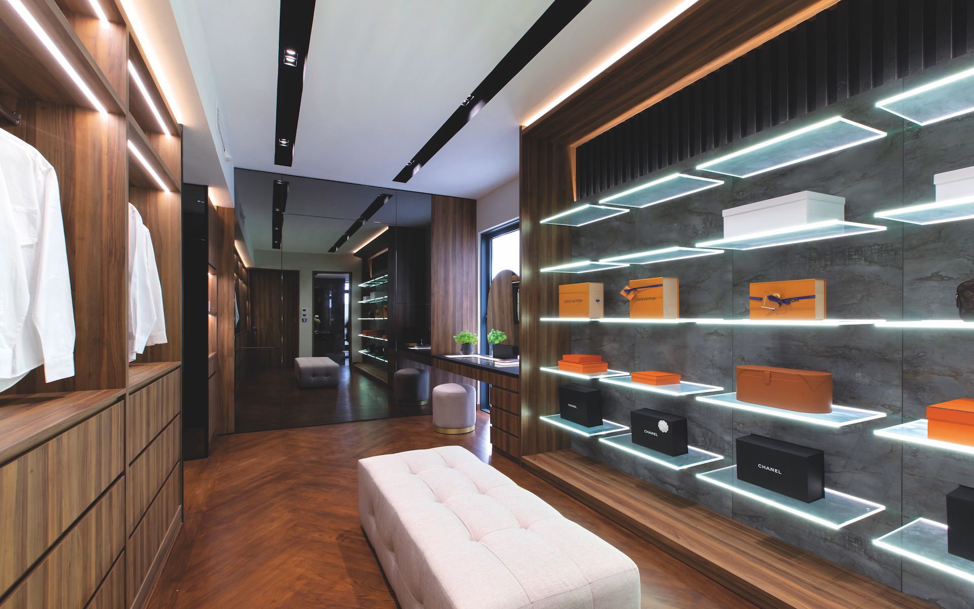 The handsomely appointed walk-in wardrobe is designed for functionality