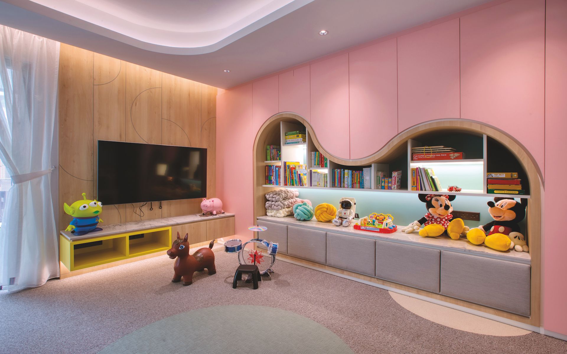 Plenty of concealed storage and open shelving ensure the play room stays neat