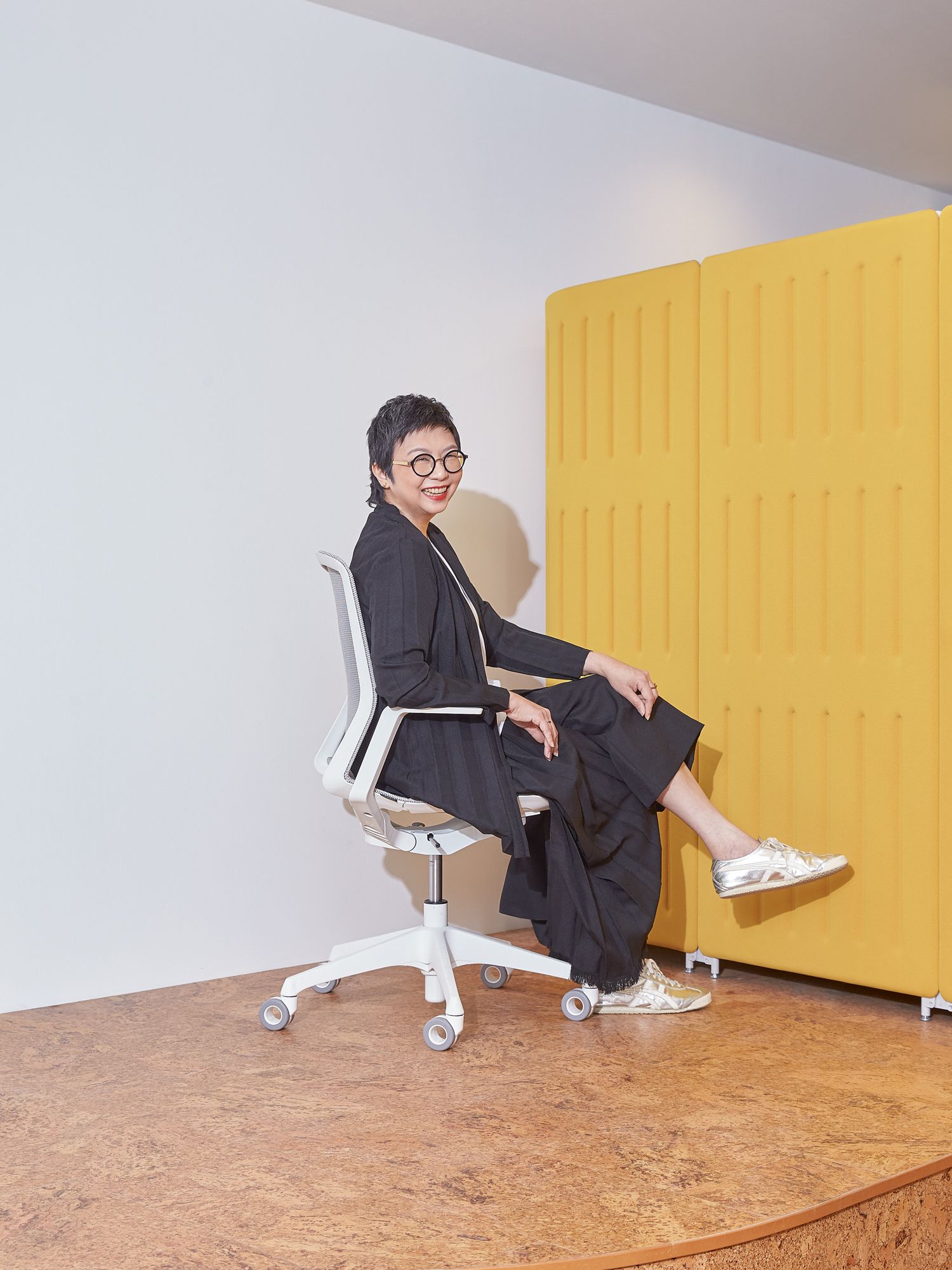 Hilary Loh, design director of 2nd Edition, tries out the Cynara task chair in the Okamura showroom