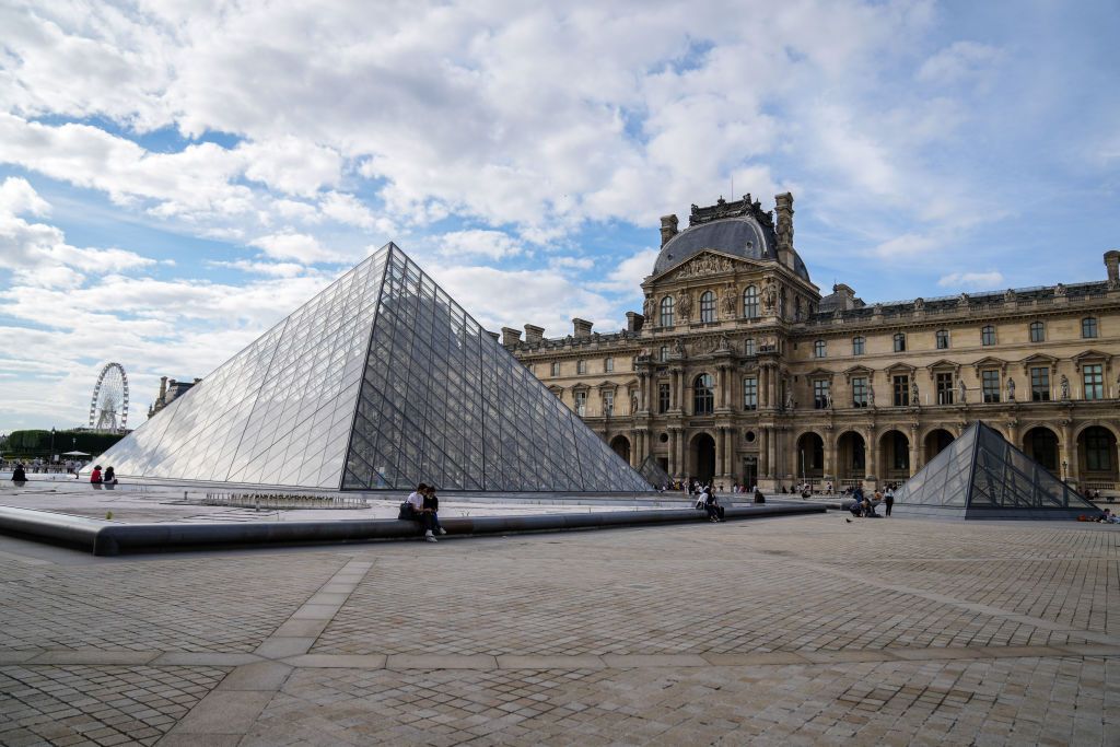 PARIS, FRANCE - JULY 03: General view of the Louvre pyramid, during the "How Did I Become A Super Hero" Premiere At "Cinema Paradiso Louvre" Festival At Cour Carre Du Louvreon July 03, 2021 in Paris, France. (Photo by Edward Berthelot/Getty Images)