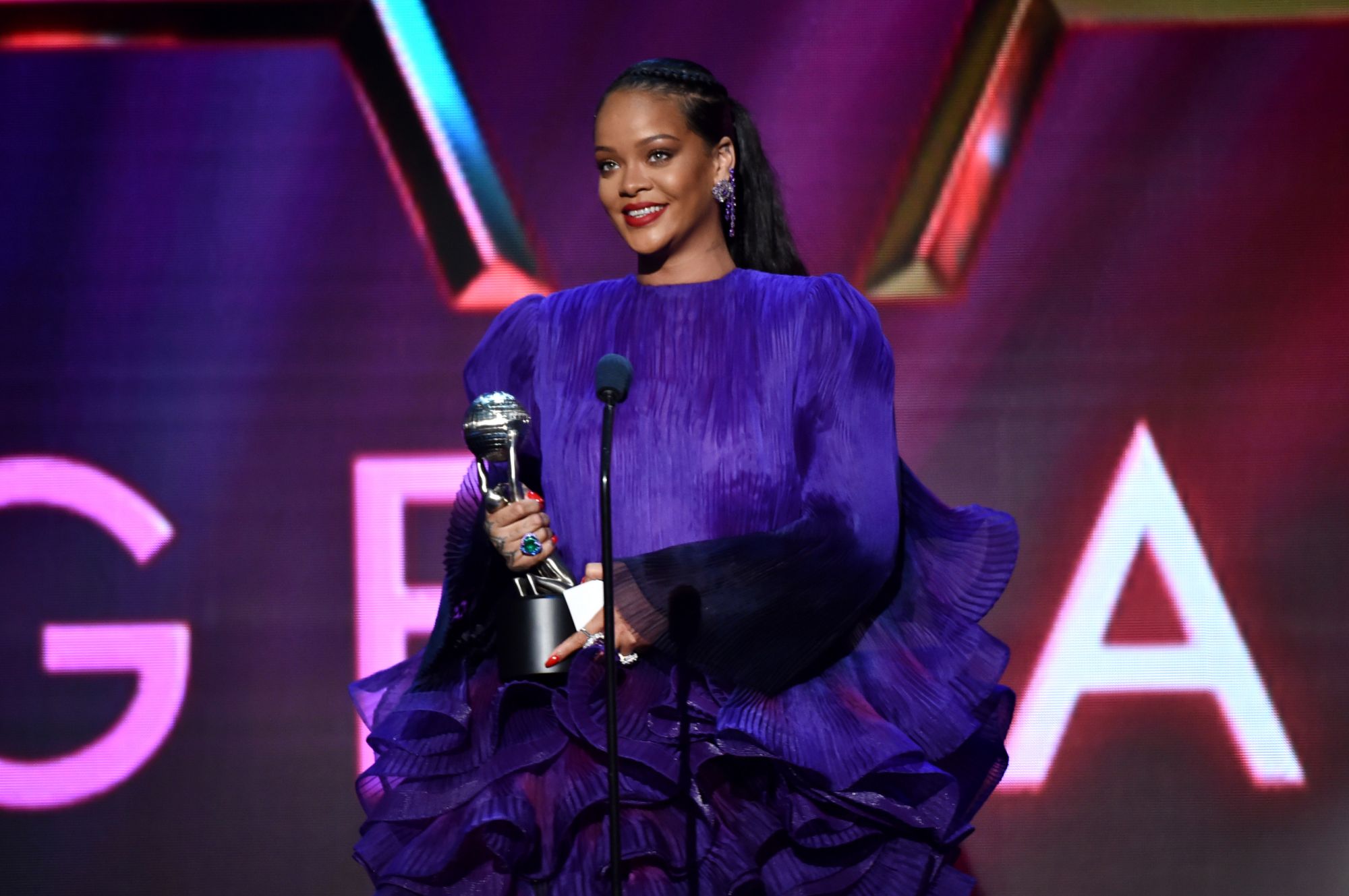 PASADENA, CALIFORNIA - FEBRUARY 22: Rihanna accepts the Presidentâs Award onstage during the 51st NAACP Image Awards, Presented by BET, at Pasadena Civic Auditorium on February 22, 2020 in Pasadena, California. (Photo by Aaron J. Thornton/Getty Images for BET)