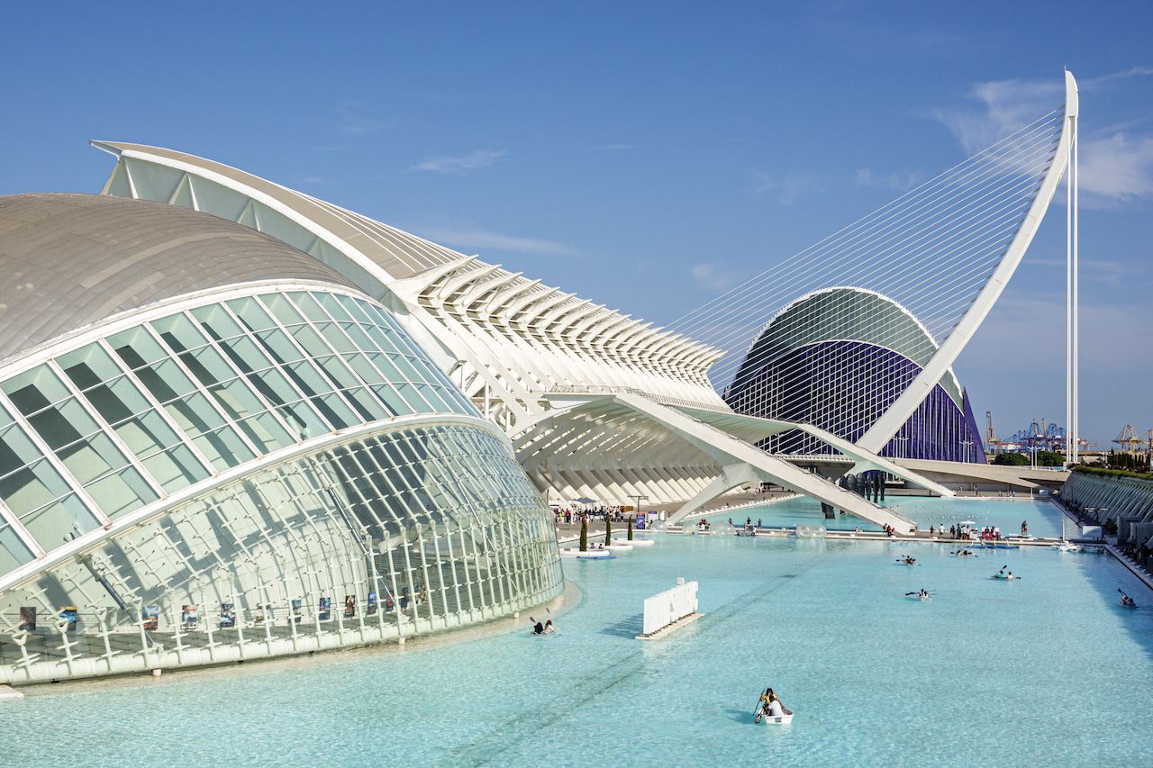 Spain, Valencia, Ciudad de las Artes y las Ciencias, City of Arts and Sciences, Santiago Calatrava, architecture, L'Hemisferic planetarium laserium, PrÃncipe Felipe Prince Philip Science Museum, Assut de l'Or Bridge, L'Agora concert venue, exteriors, water pool, Spanish Europe EU Eurozone,