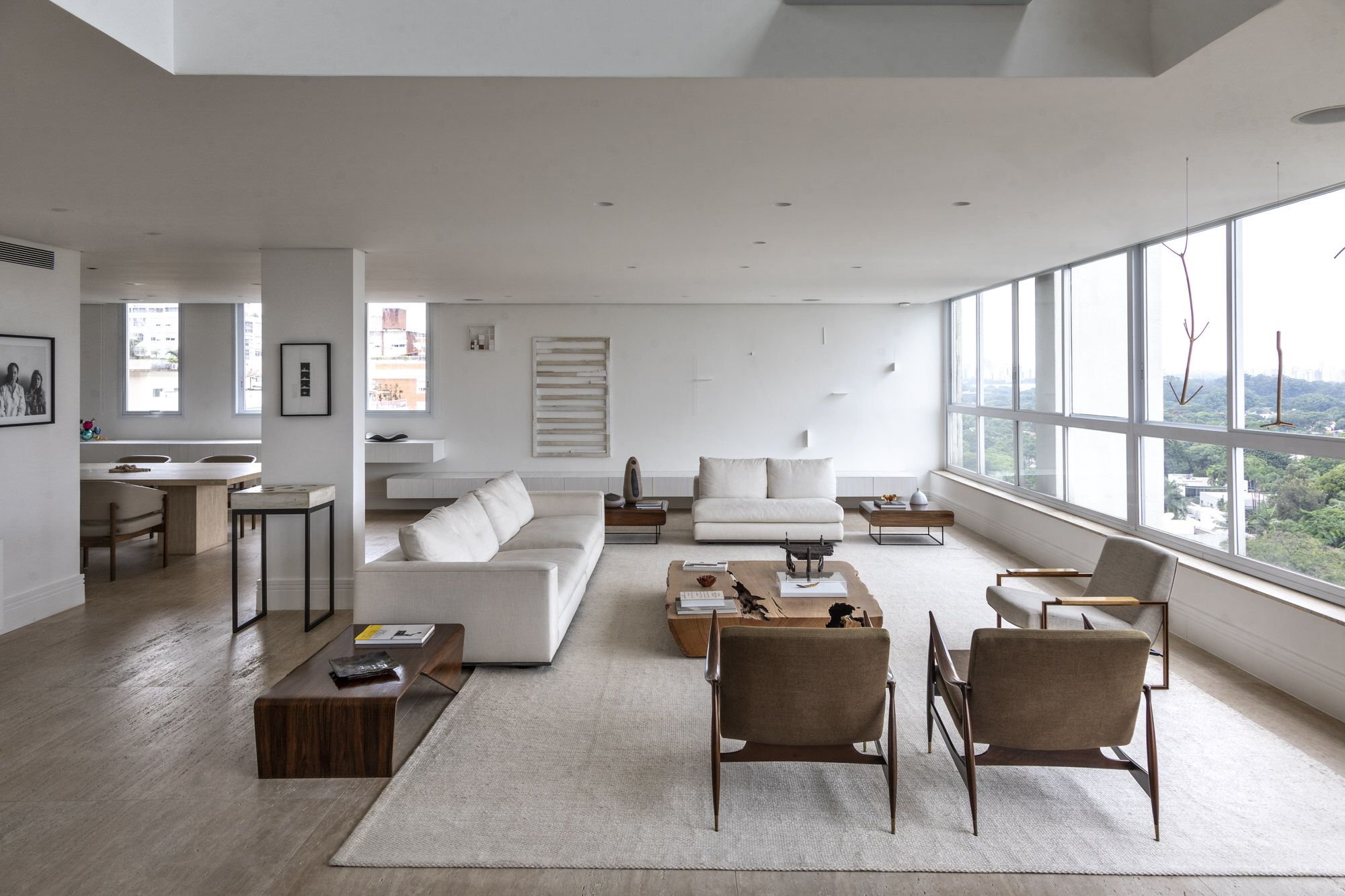 The lower living room, furnished with vintage furniture, emits a serene and calming vibe
