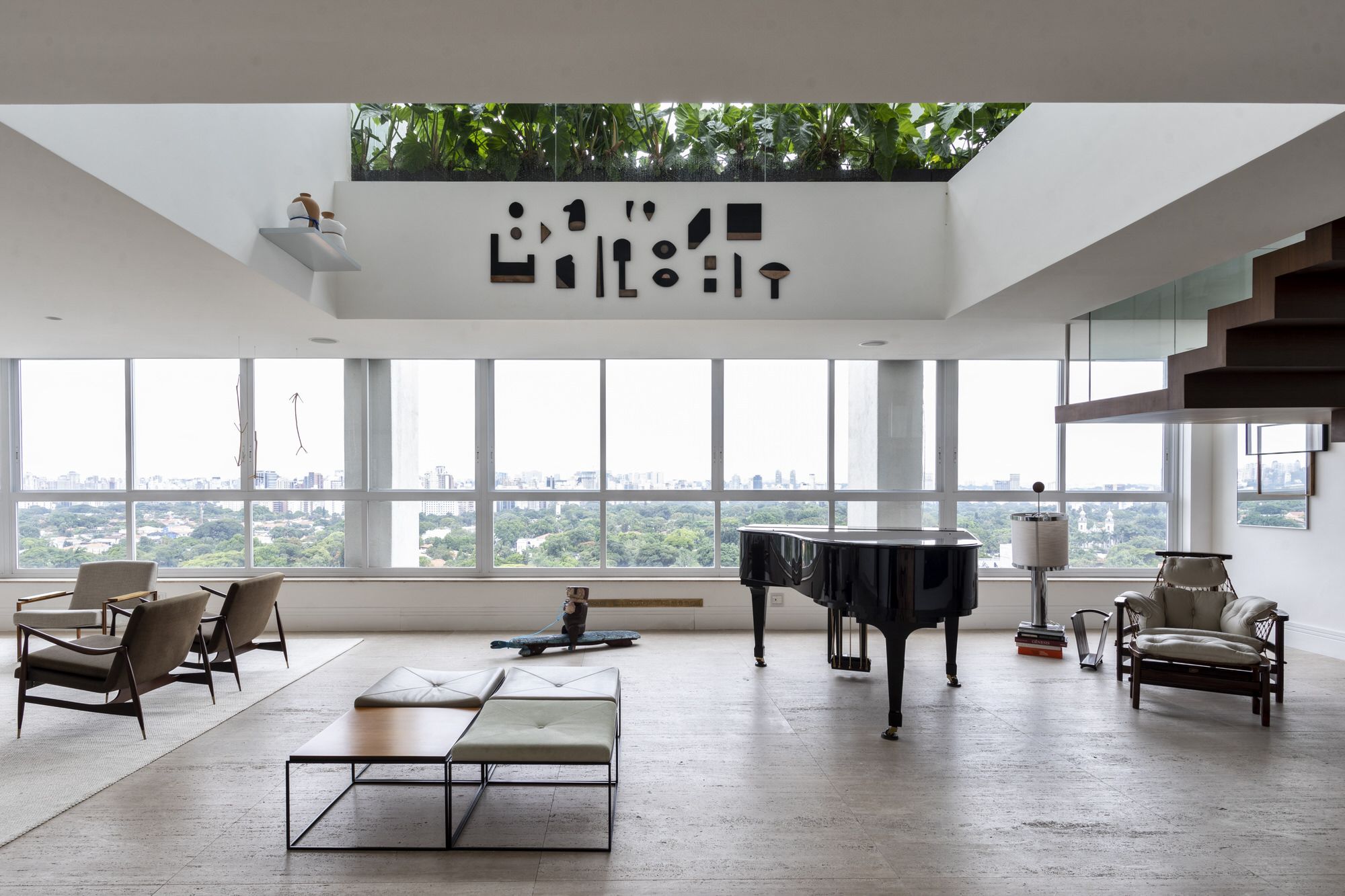The lofty abode boasts scenic views that one can gaze at through the glass windows