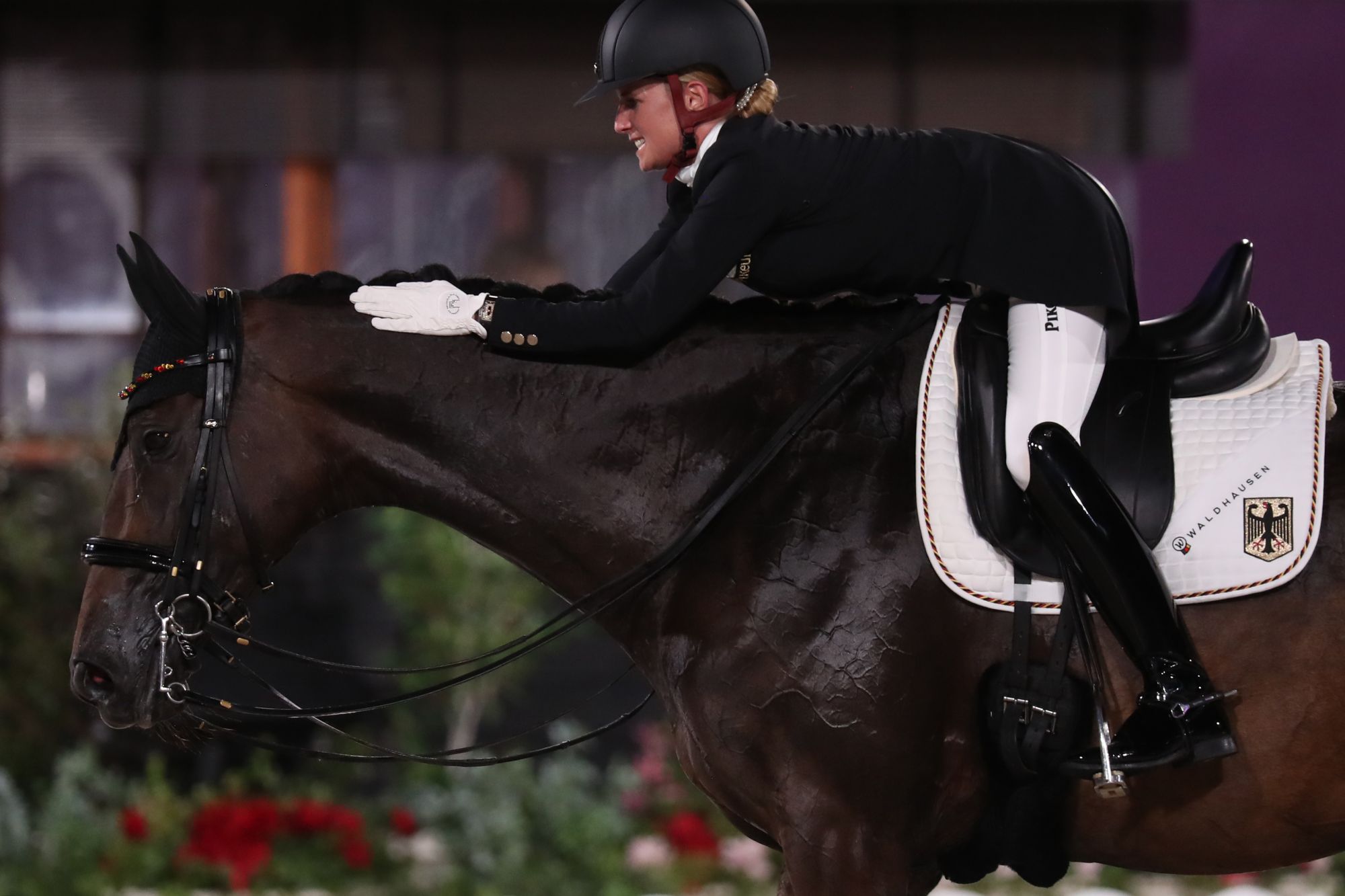 24 July 2021, Japan, Tokio: Equestrian Sport/Dressage: Olympia, Preliminary Competition, Individual, Grand Prix, at the Baji Koen Equestrian Park. Jessica von Bredow-Werndl from Germany praises the horse TSF Dalera as she leaves the dressage arena. Photo: Friso Gentsch/dpa (Photo by Friso Gentsch/picture alliance via Getty Images)