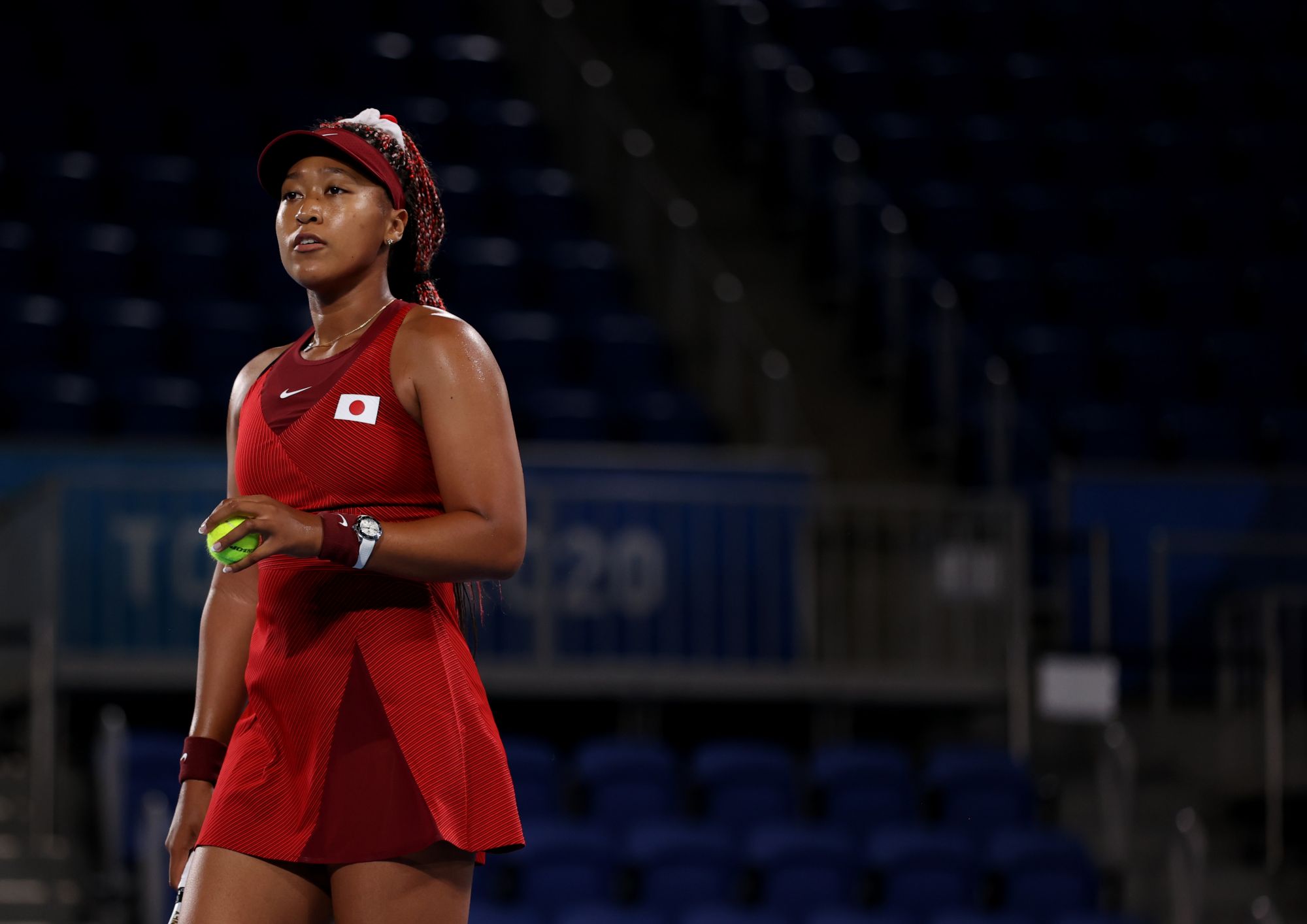 TOKYO, JAPAN - JULY 27: Naomi Osaka of Team Japan prepares to serve during her Women's Singles Third Round match against Marketa Vondrousova of Team Czech Republic on day four of the Tokyo 2020 Olympic Games at Ariake Tennis Park on July 27, 2021 in Tokyo, Japan. (Photo by David Ramos/Getty Images)