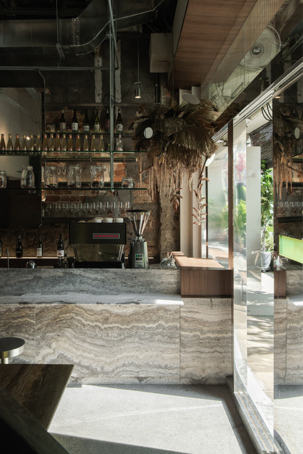 A hanging sculpture of dried flowers by Za Huo Hang greet guests