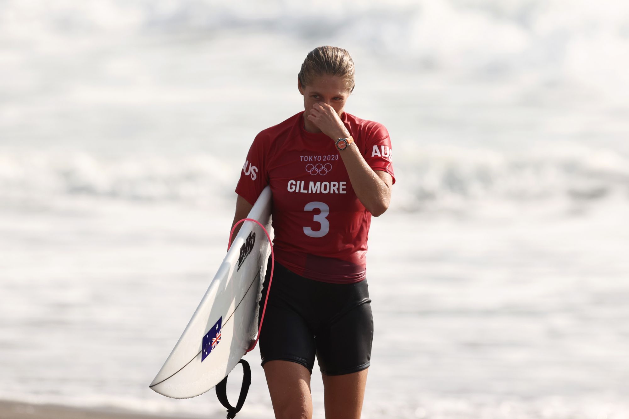 ICHINOMIYA, JAPAN - JULY 26: Stephanie Gilmore of Team Australia reacts after losing her during the Women's Round 3 heat on day three of the Tokyo 2020 Olympic Games at Tsurigasaki Surfing Beach on July 26, 2021 in Ichinomiya, Chiba, Japan. (Photo by Ryan Pierse/Getty Images)