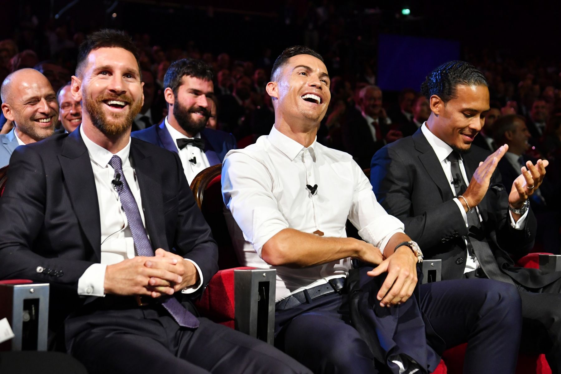 MONACO, MONACO - AUGUST 29: Cristiano Ronaldo of Juventus, Lionel Messi of FC Barcelona and Virgil Van Dijk of Liverpool react during the UEFA Champions League Draw, part of the UEFA European Club Football Season Kick-Off 2019/2020 at Salle des Princes, Grimaldi Forum on August 29, 2019 in Monaco, Monaco. (Photo by Harold Cunningham - UEFA/UEFA via Getty Images)