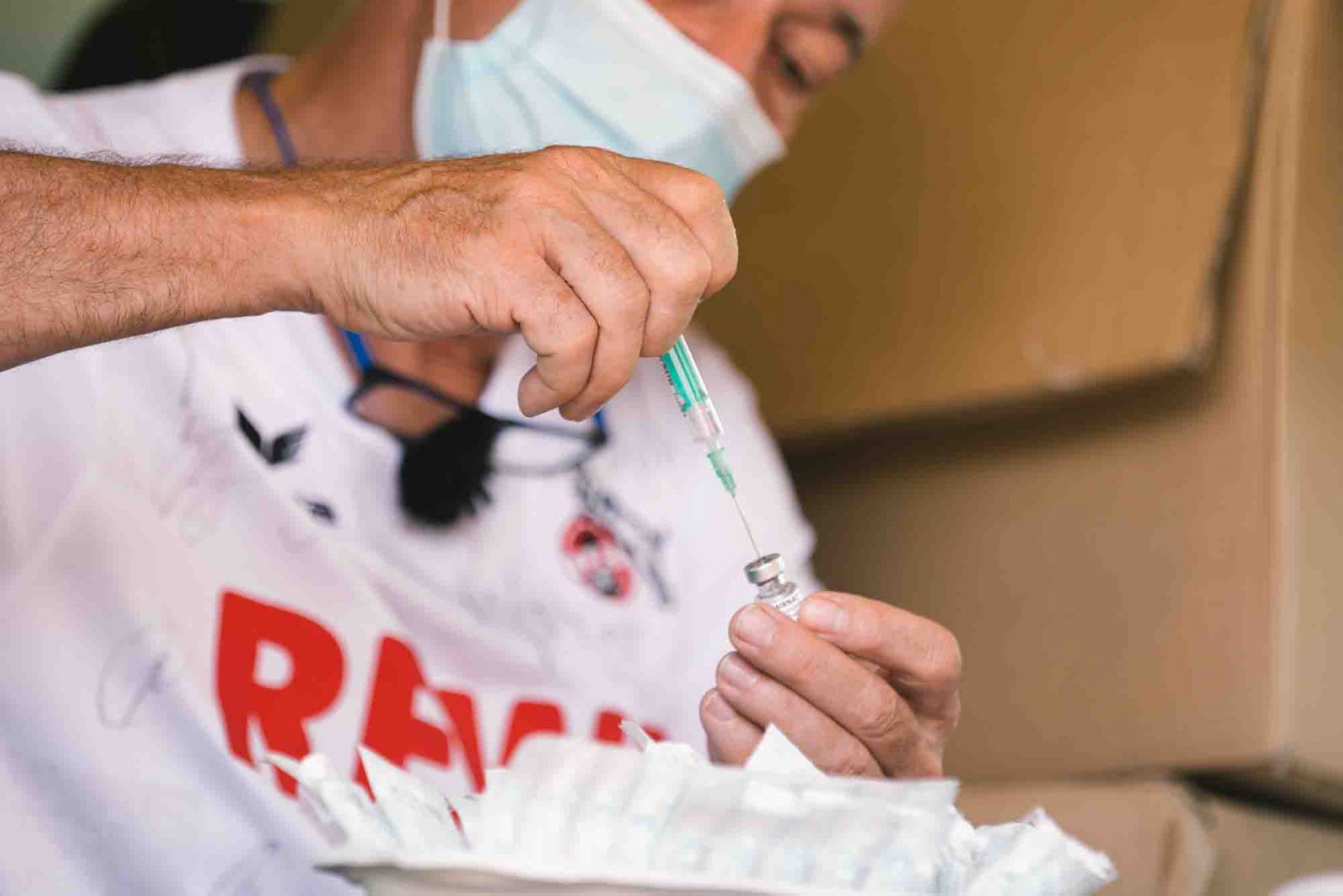 A medical staff prepares the vaccine in a mobile bus in front of Rhein Energy stadium in Cologne, Germany. (Photo: Getty Images)