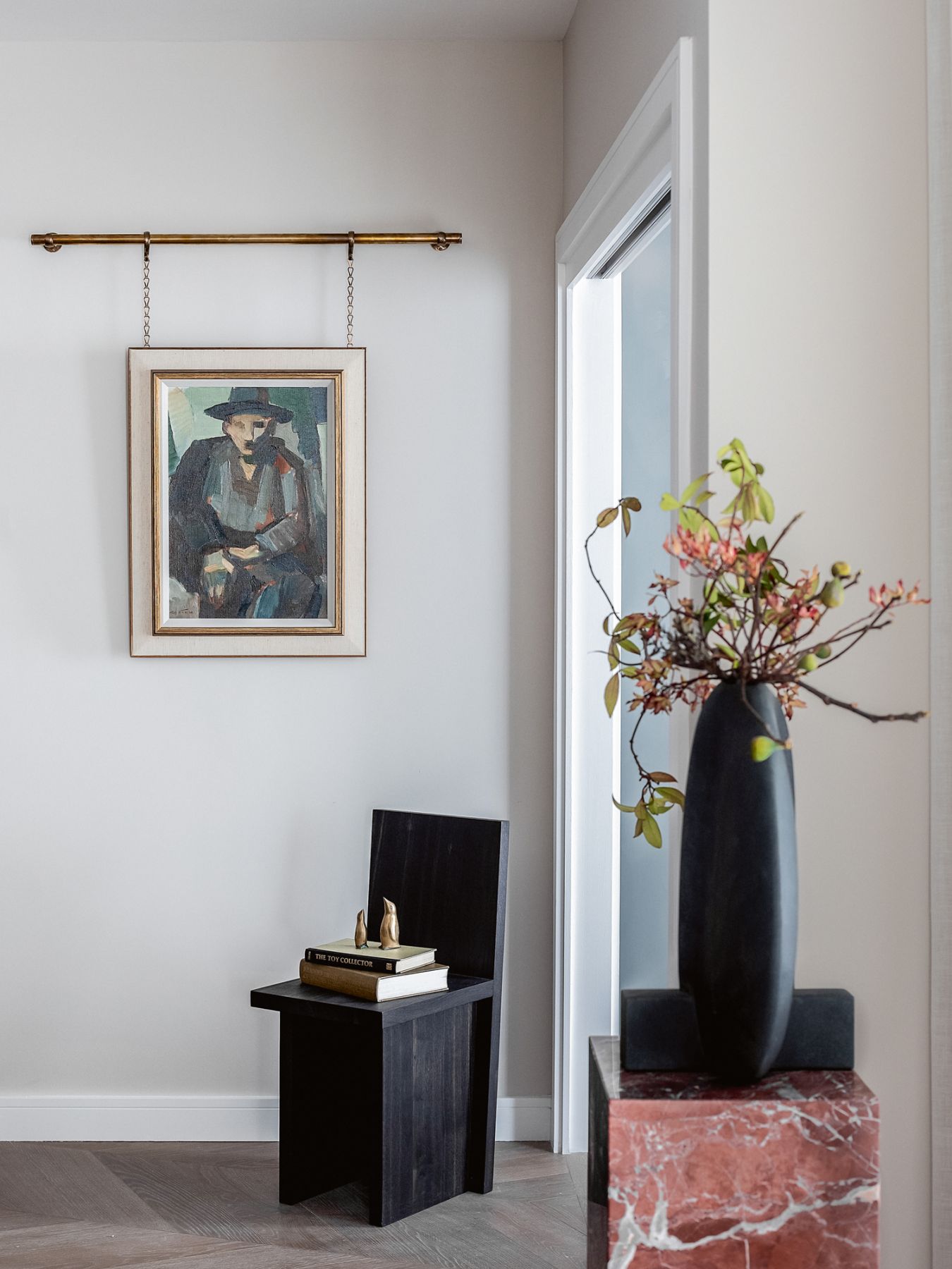 Hung on a brass rail, this artwork creates an eye-catching corner in the home