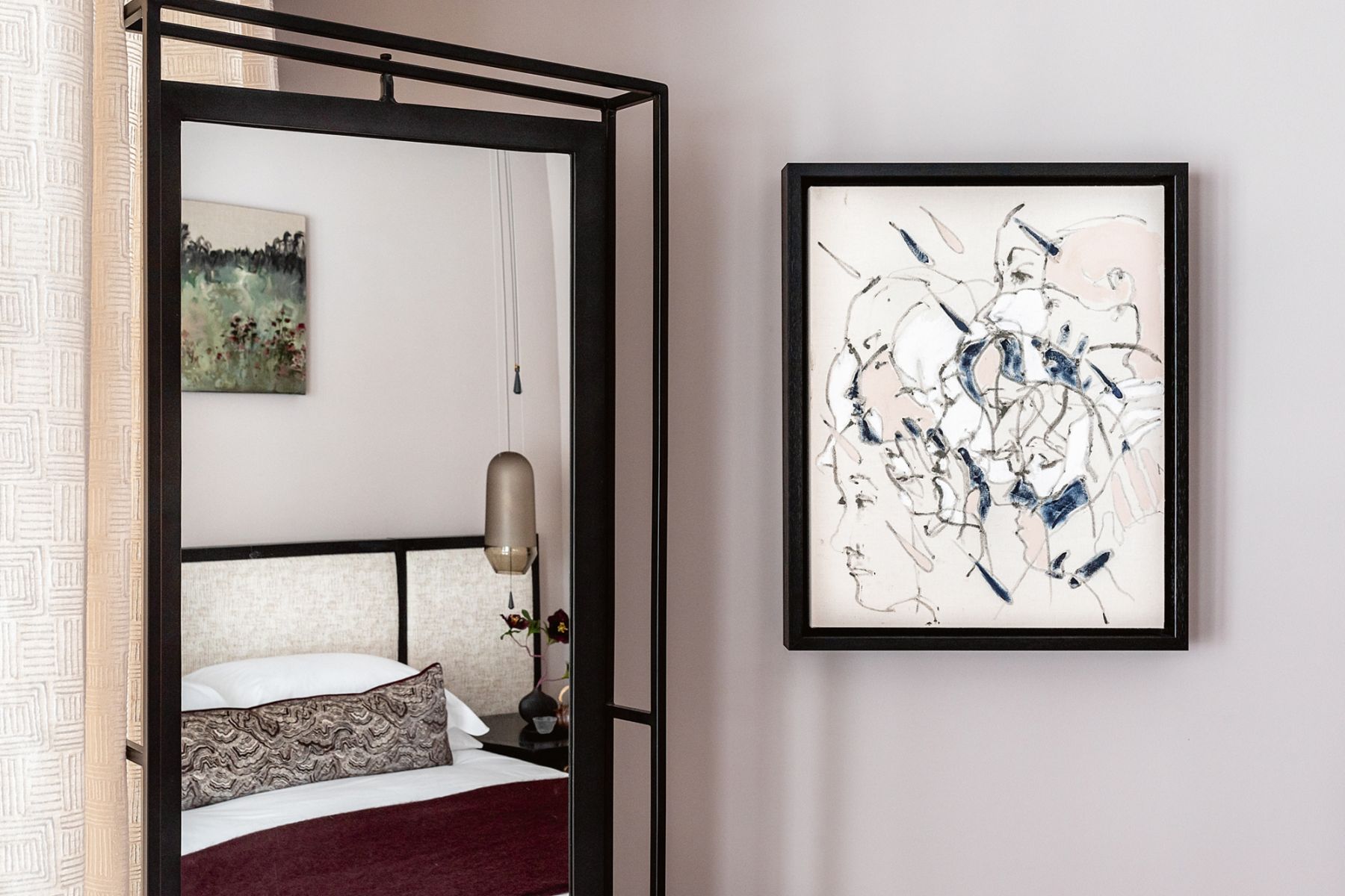 An artwork by Morag Caister brings visual interest to a corner of this bedroom